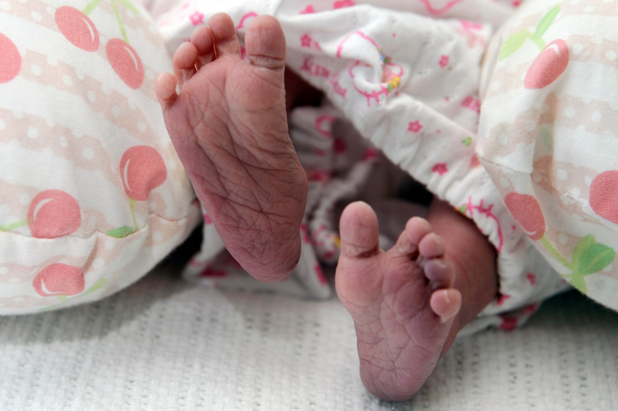 Evangeline Evelyn Chiu, daughter of Staff Sgt.  Shangjung Chiu, 35th Maintenance Operations Squadron, production analyst, and Christi-June, flexes her feet at Misawa Air Base, Japan, Jan. 4. Evangeline was approximately three weeks early and weighed 5 pounds 1 ounces and was 19.3 inches long. (U.S. Air Force photo by Tech. Sgt. Marie Brown)
