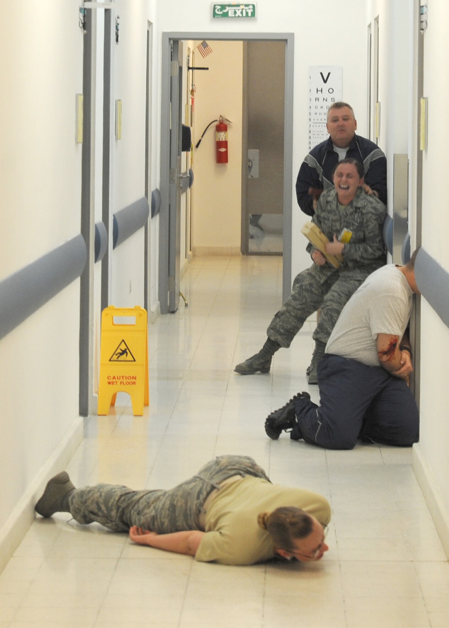 SOUTHWEST ASIA – Panic ensues in the 379th Expeditionary Medical Group clinic, as an active-shooter exercise plays out Dec. 28. The training provided real-time scenarios for the 379th EMDG and Expeditionary Security Forces Squadron Airmen on what to do during a shooting. (U.S. Air Force photo/Senior Airman Joel Mease)