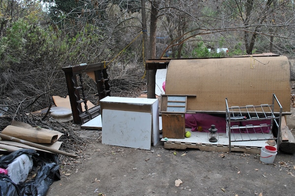 Trash in the vegetative management area south of Burbank Boulevard. The five-year vegetation management plan is restricted to the 48 acres south of the boulevard and will reintroduce diverse, sustainable native species while maintaining the basin's primary function flood risk management.