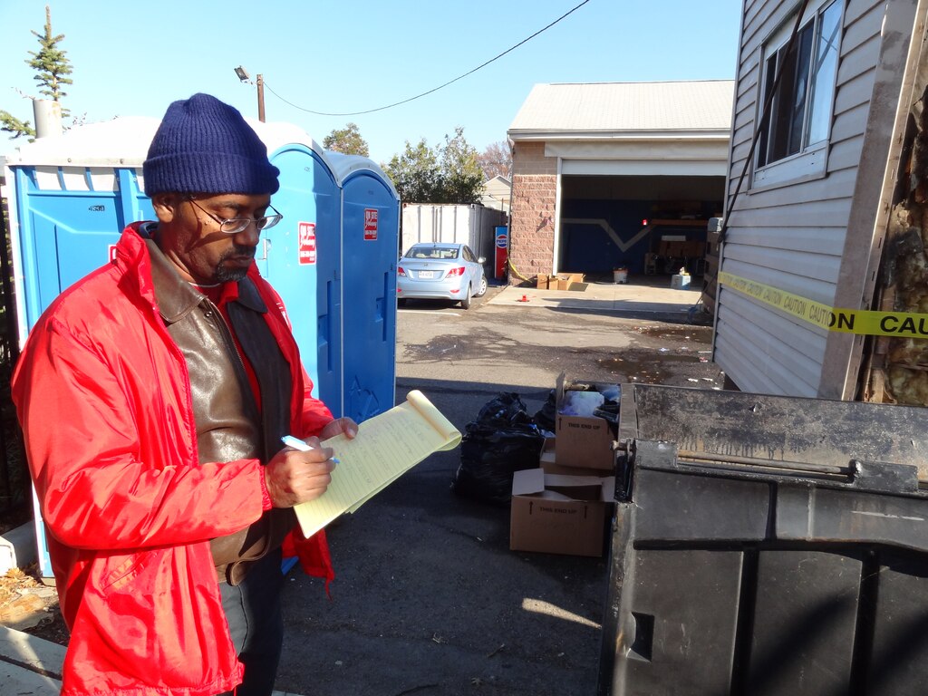 Jacksonville District Electrical Engineer Gerald Deloach assesses damage to a building in Moonachie, N.J. that was damaged by Hurricane Sandy. Deloach was one of a dozen people from Jacksonville District that deployed to the impact zone. 