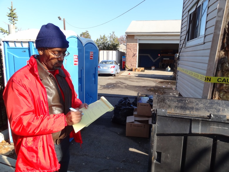Jacksonville District Electrical Engineer Gerald Deloach assesses damage to a building in Moonachie, N.J. that was damaged by Hurricane Sandy. Deloach was one of a dozen people from Jacksonville District that deployed to the impact zone. 