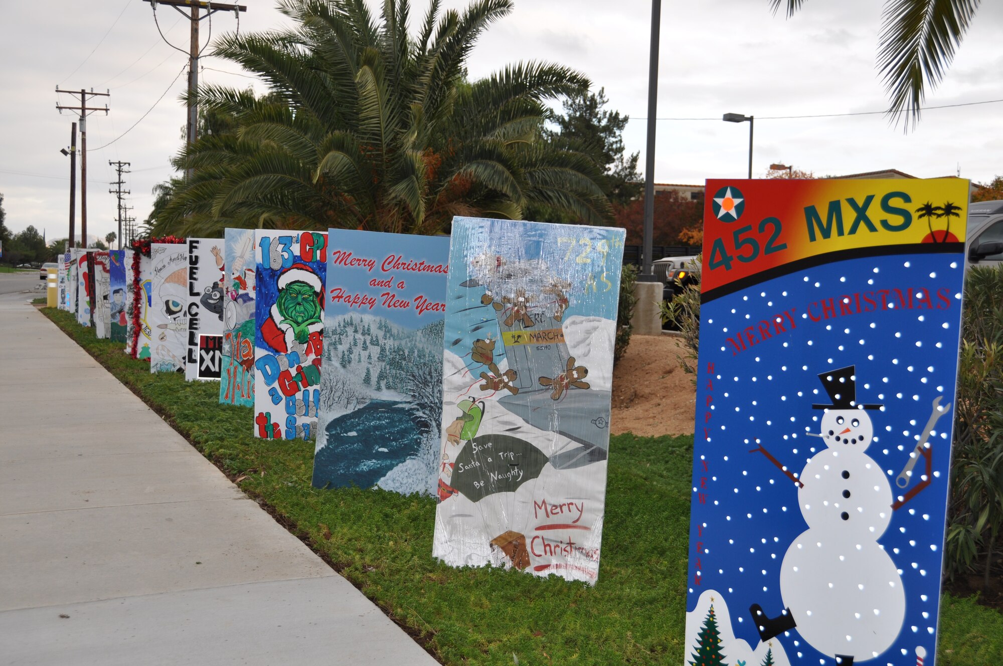 An oversize, handmade holiday greeting card lines greets Team March members as they enter and exit base during the holiday season. More than a dozen cards were on display from various units around the base.(U.S. Air Force photo)

