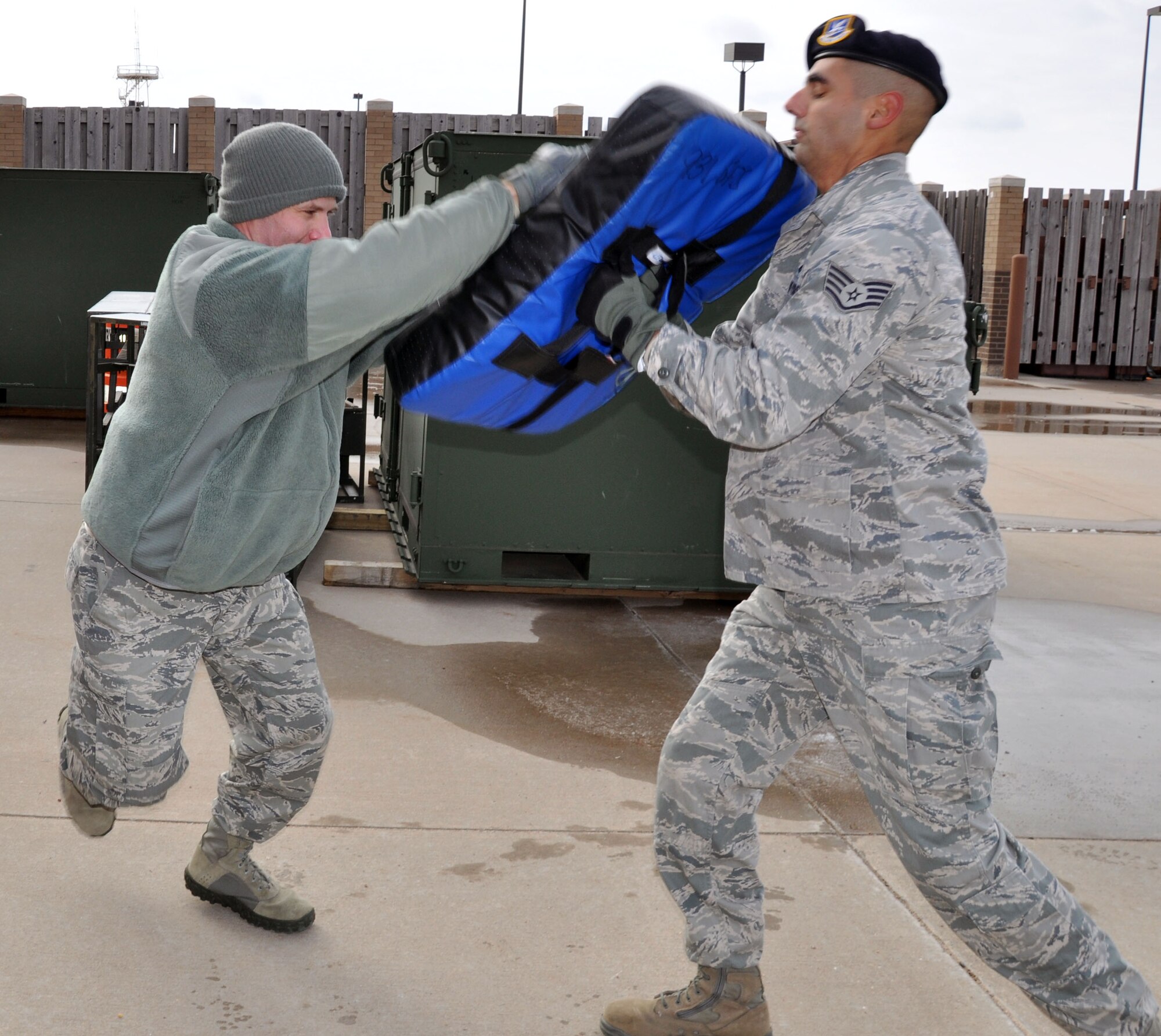 Staff Sgt. Kyle Behymer, 931st Security Forces Squadron, practices blocking an attack from Staff Sgt. Nicholas Horine, 931 SFS, during open-hand combat training at McConnell Air Force Base, Kan., Jan. 5, 2013.  The 931st Security Forces Squadron conducted training on blocking and striking techniques during the January unit training assembly to prepare their members to defend themselves in a hand-to-hand combat situation.  (U.S. Air Force photo by 1st Lt. Zach Anderson)