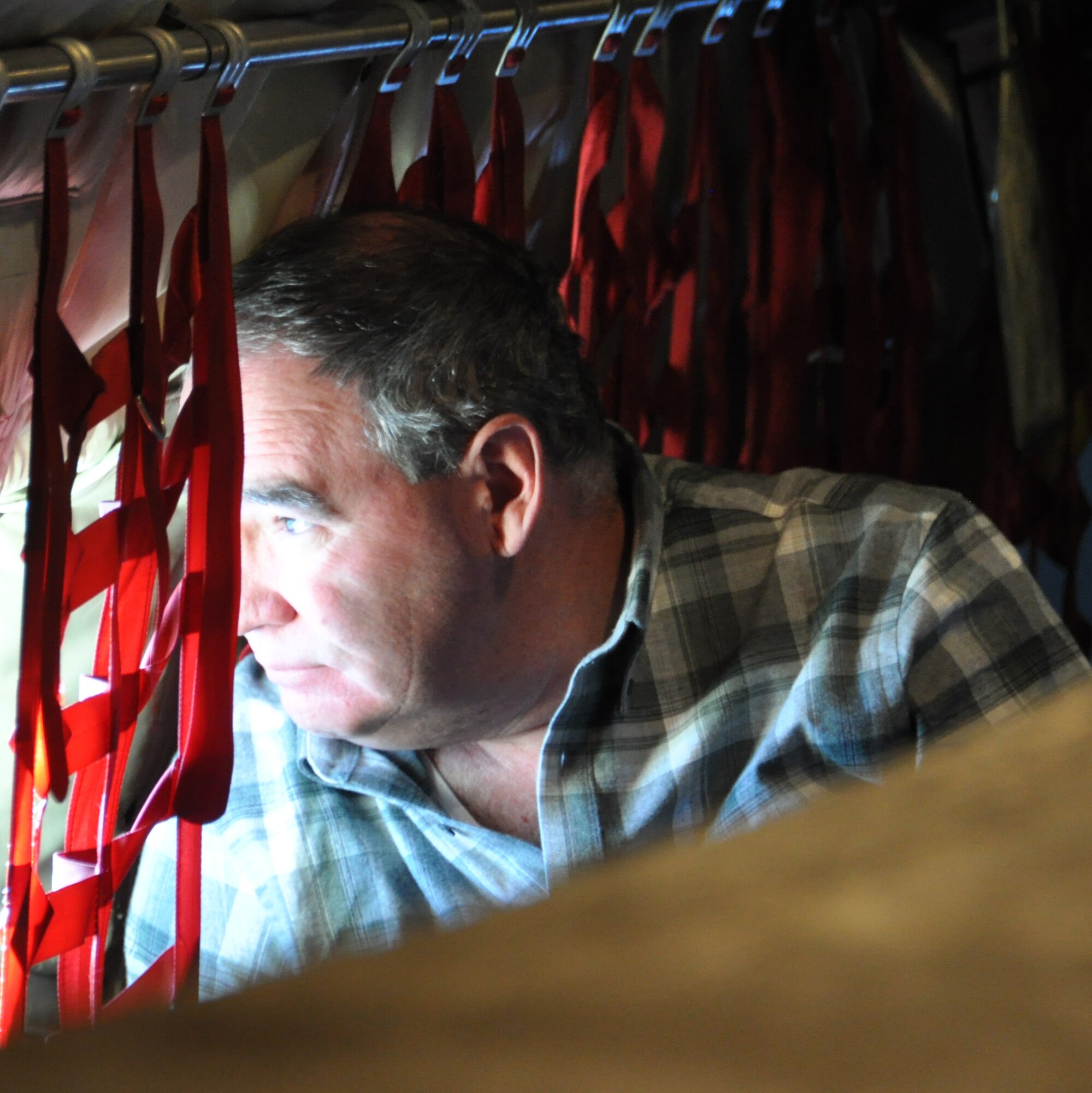 Bill Behnke, 477th FG Honorary Commander and GCI senior vice president, looks out the window of an Oklahoma Air National Guard KC-135 at the F-22 Raptors flying just off the wing. The 477th FG hosted its first civic leader flight Jan. 5, allowing for community leaders to see the Reserve F-22 mission up close. (U.S. Air Force Reserve/Tech. Sgt. Dana Rosso) 