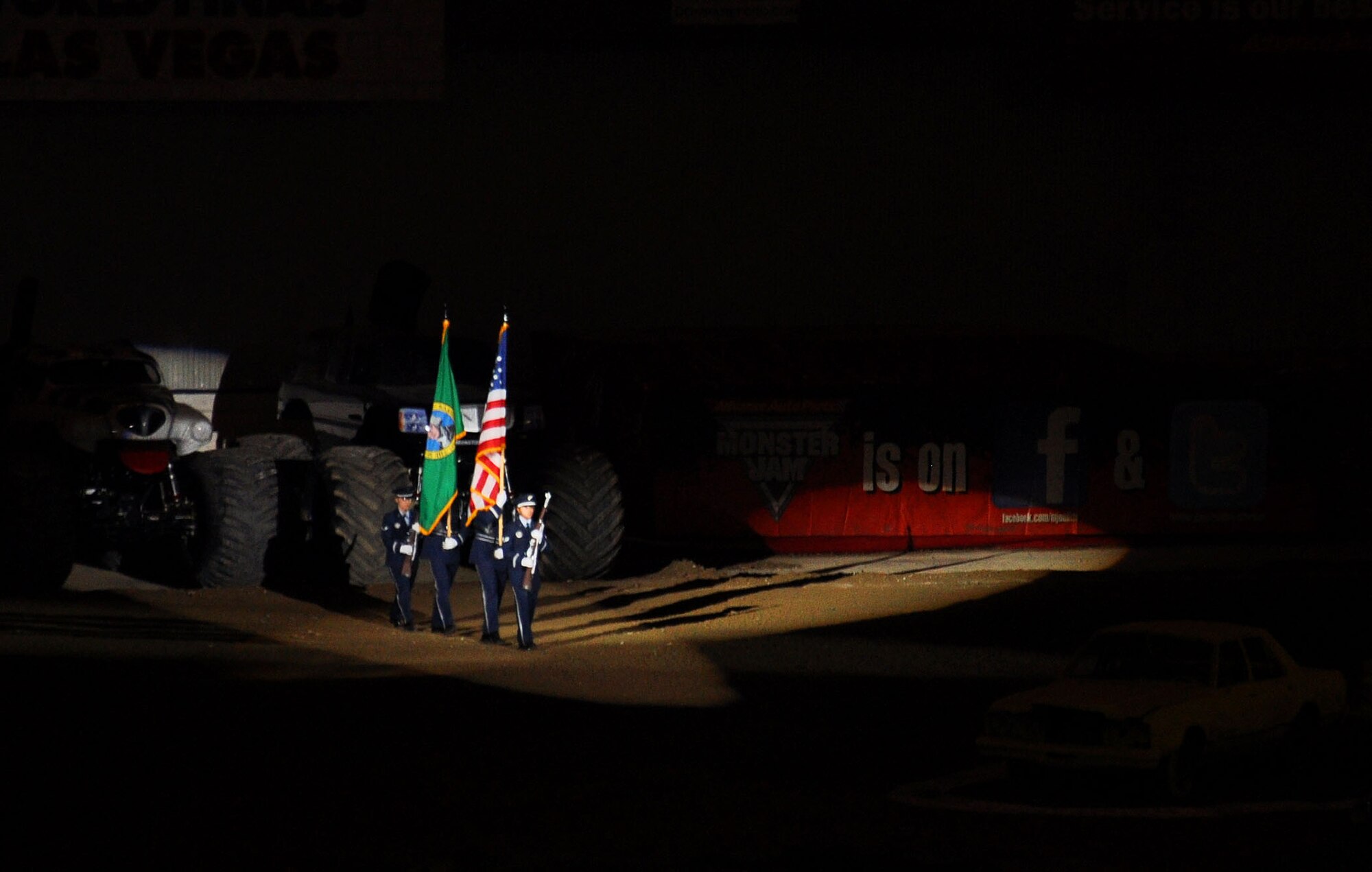 The McChord Field Honor Guard presents the flags to the crowd at Monster Jam at the Tacoma Dome Jan. 5, 2013. Airmen from the Honor Guard presented the flags at each of the four shows over the three day event. (U.S. Air Force Photo/Airman 1st Class Madelyn McCullough)