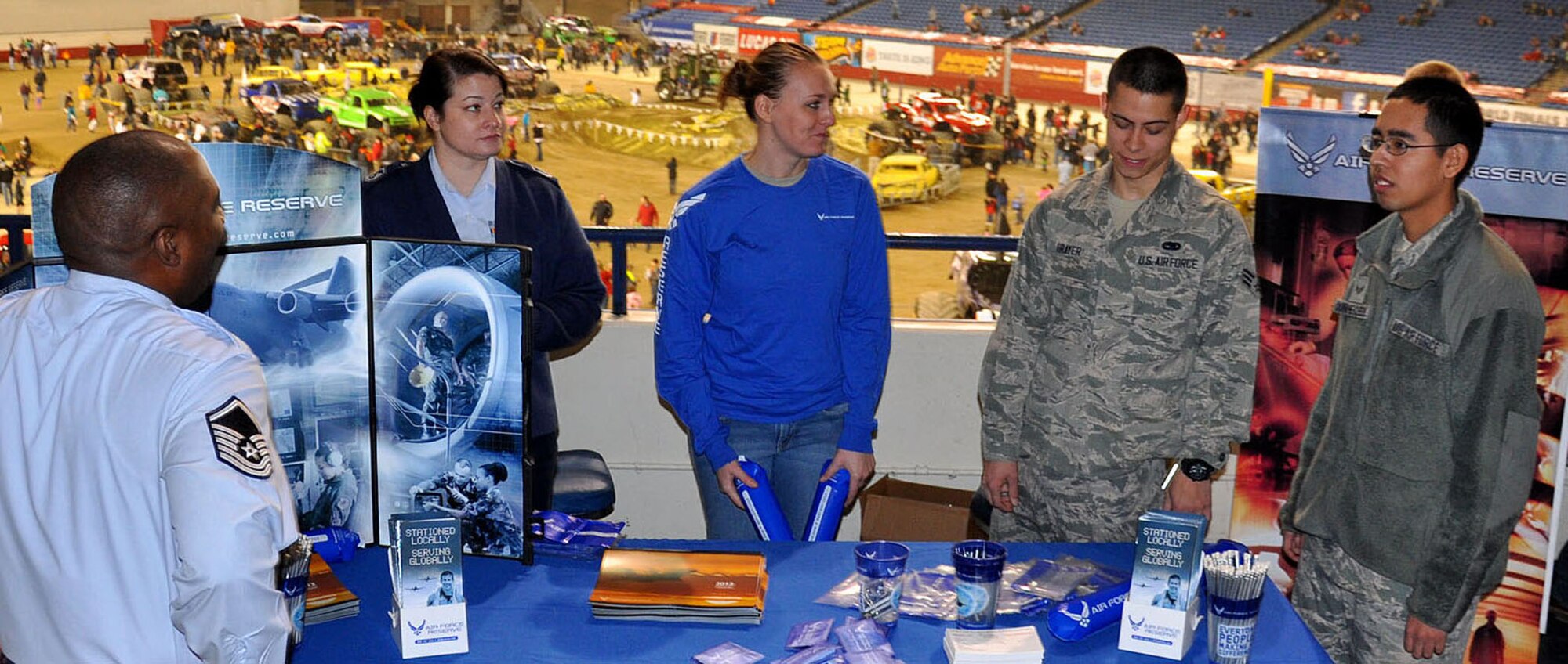 Recruiters, airmen, and future airmen all help spread word about the Air Force Reserve while guests flock to see the Monster Jam trucks at the Tacoma Dome Jan. 5, 2013. The event allowed them to spread awareness to the people who attended Monster Jam. (U.S. Air Force Photo/Airman 1st Class Madelyn McCullough)