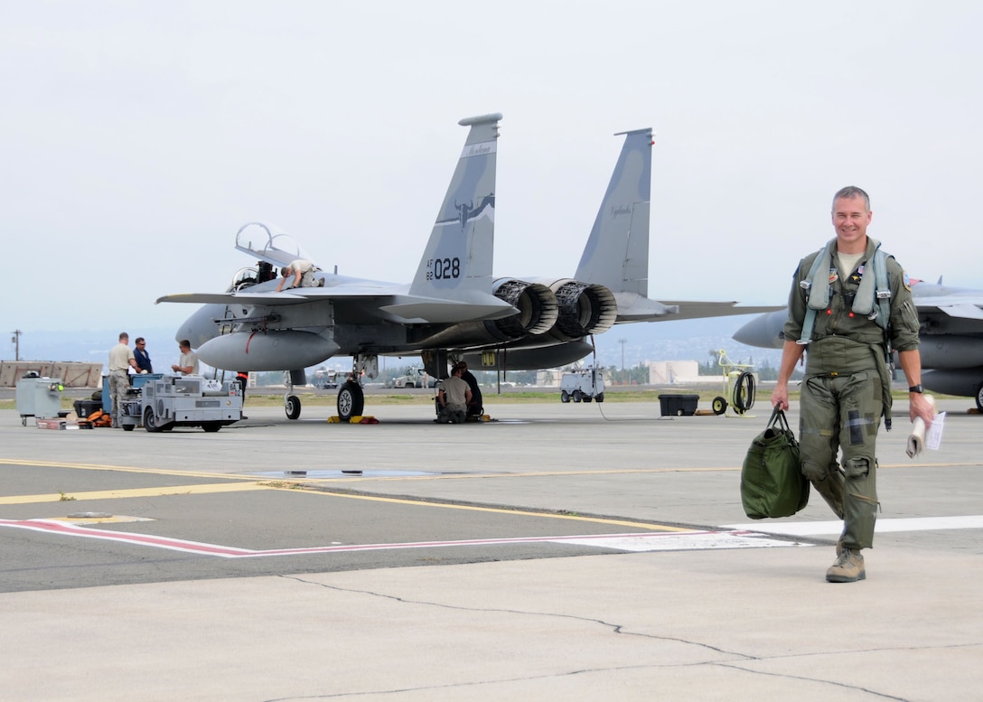 120th Fighter Wing Detachment 1 Commander Lt. Col. James Bong walks away from his aircraft following a training mission flown from Joint Base Pearl Harbor-Hickam on Dec. 5, 2012.  National Guard photo by Senior Master Sgt. Eric Peterson.