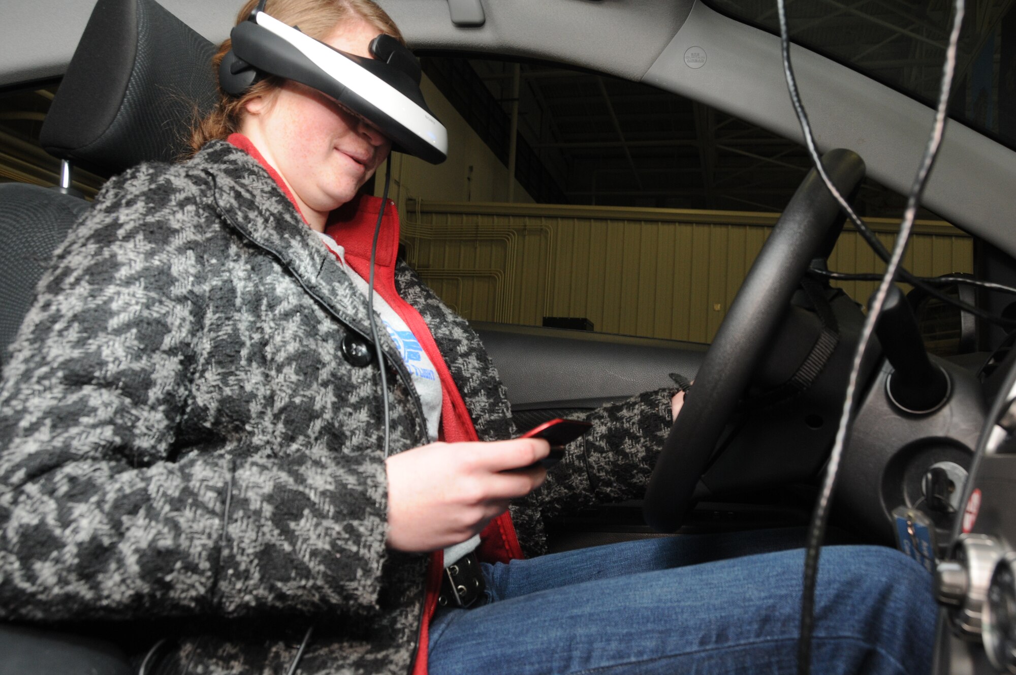 Student flight member Heidi Mailahn, of the 185th Air Refueling Wing (ARW), Sioux City, IA., Iowa Air National Guard, drives in a texting virtual reality simulator, on January 6, 2013. The PEERS Foundation, a nonprofit organization that focuses on helping young men and women make healthy decisions, brought in a driving simulator to highlight the dangers of texting while driving.
Official Photo by: TSGT Oscar Sanchez

