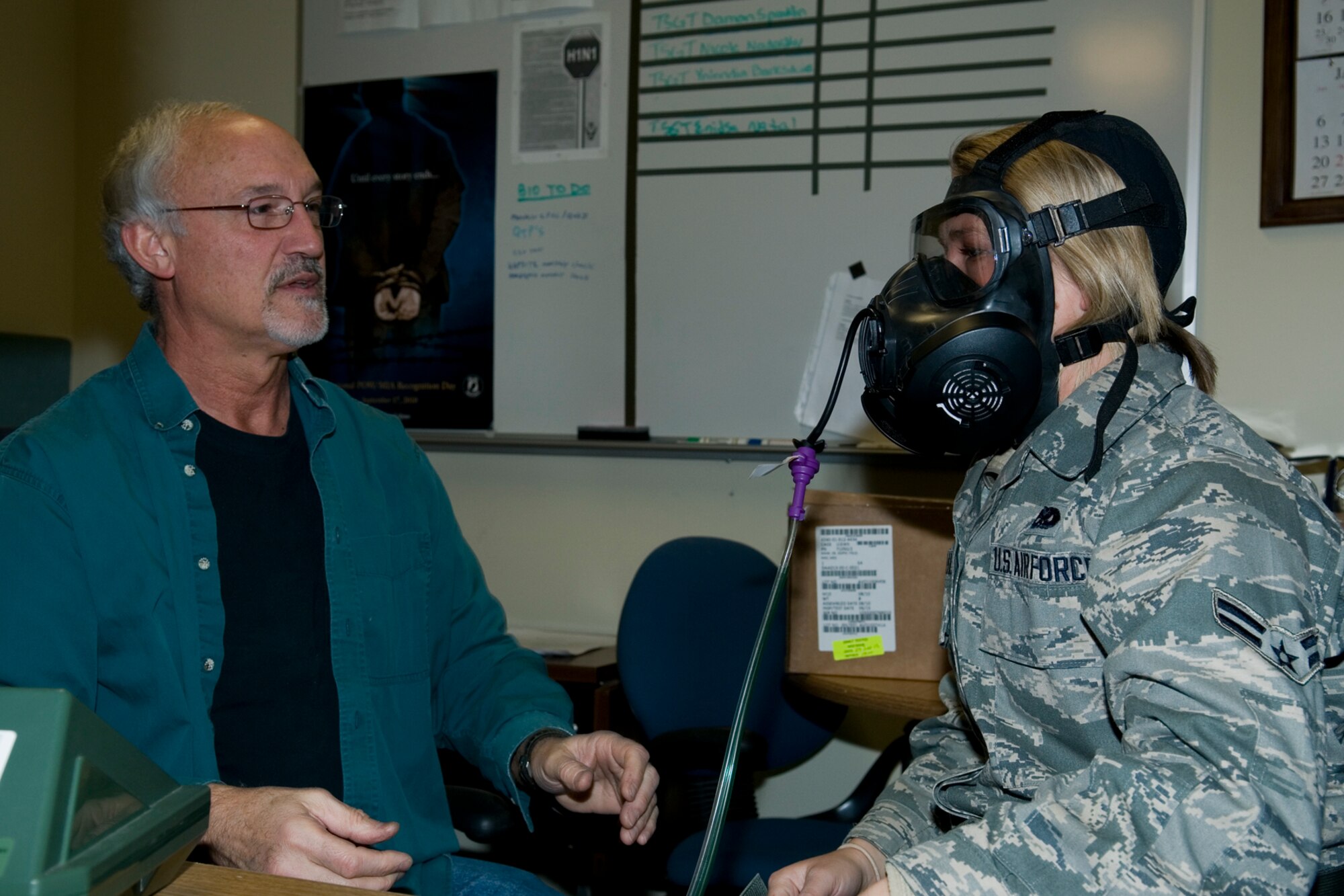 GRISSOM AIR RESERVE BASE, Ind. -- Tom Wallace, 434th Mission Support Group environmental health technician, fits and tests an M50 gas mask for Airman 1st Class Torrie Bailey, 434th Maintenance Squadron KC-135R crew chief, here Jan. 5. The 434th MSG bioenvironmental engineering team began fitting Airmen for the new masks and will continue to do so over the coming months. (U.S. Air Force photo/Senior Airman Andrew McLaughlin)