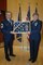 Chief Master Sgt. Steve Schiele presents a shadow box to Lt. Col. Cecilia Nackowski during her retirement ceremony at the Utah Air National Guard Base Dec. 2. Nackowski formally retired after 35 years of military service.(U.S. Air Force photo by Capt. Wayne Lee)(RELEASED)
