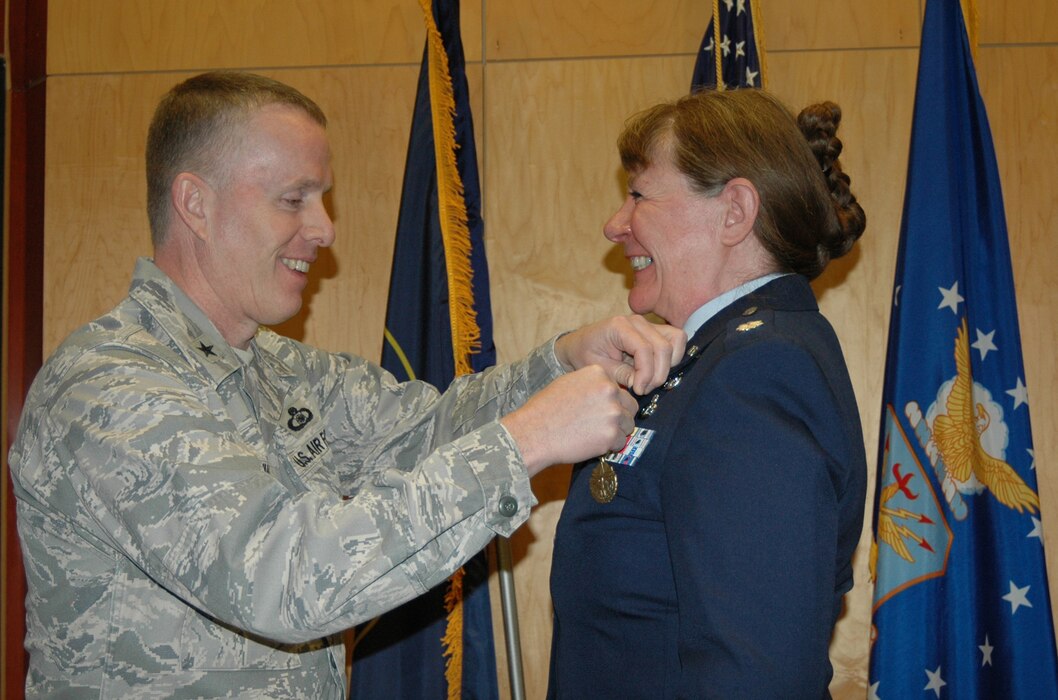 Brig. Gen. Kenneth Gammon presented the Meritorious Service Award to Lt. Col. Cecilia Nackowski during her retirement ceremony at the Utah Air National Guard Base Dec. 2. Nackowski formally retired after 35 years of military service. (U.S. Air Force photo by Capt. Wayne Lee)(RELEASED)
