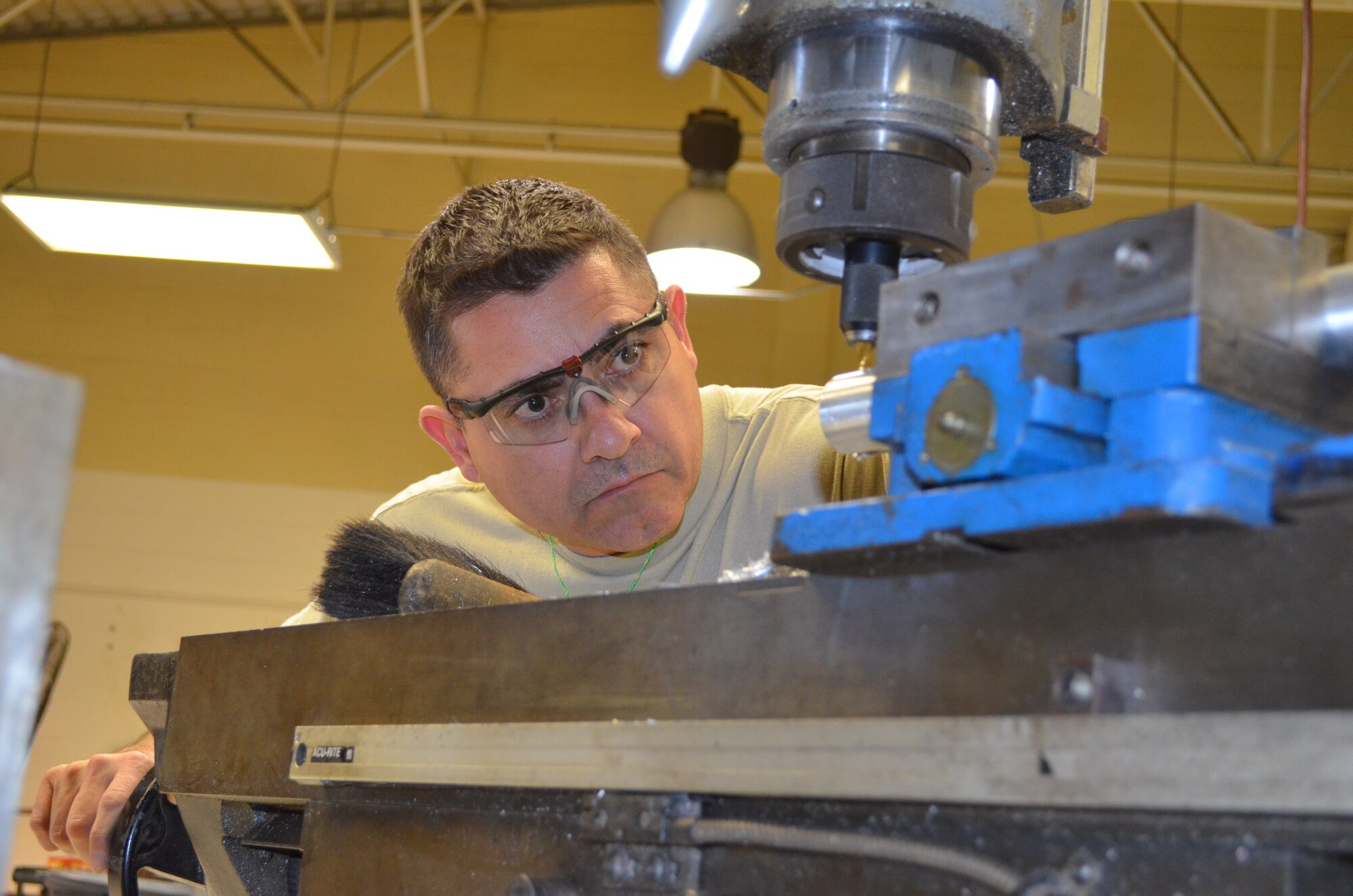 Tech. Sgt. Jose Valadez, 433rd Maintenance Squadron, machines a tool for the 433rd Operations Support Squadron in the metals workshop at Joint Base San Antonio-Lackland, Texas on Jan. 5, 2013. The tool is used to pack emergency escape slides for the C-5A Galaxy aircraft assigned to the unit. (U.S. Air Force Photo/Maj. Tim Wade)