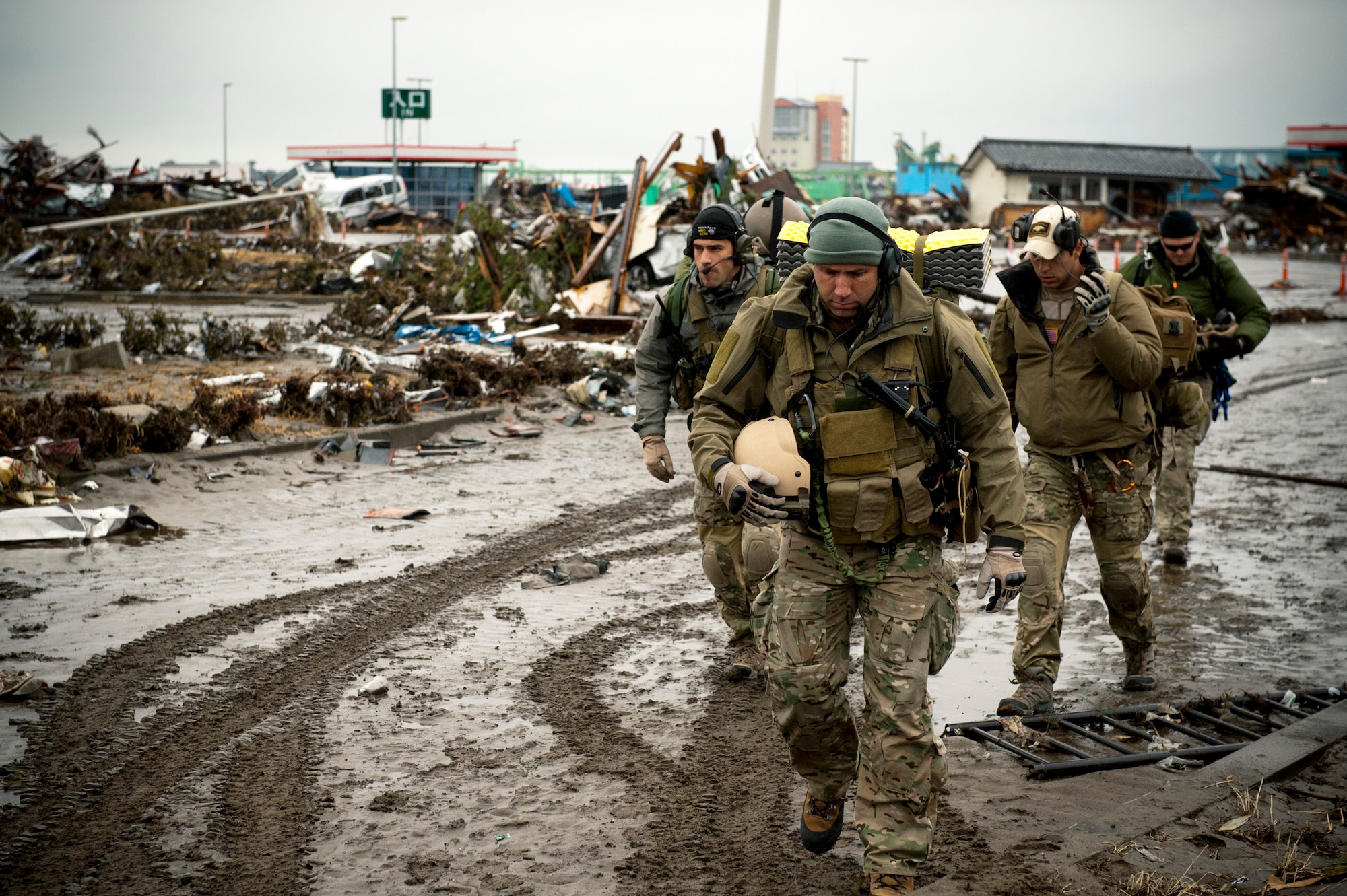 Members of the 320th Special Tactics Squadron assess the damage at
Sendai Airport in Japan, March 16, 2011. The 353rd Special Operations Group's involvement in OperationTomodachi is one of the many examples that contributed to earning the Meritorious Unit Award. (U.S. Air Force photo/Staff Sgt. Samuel Morse) 
