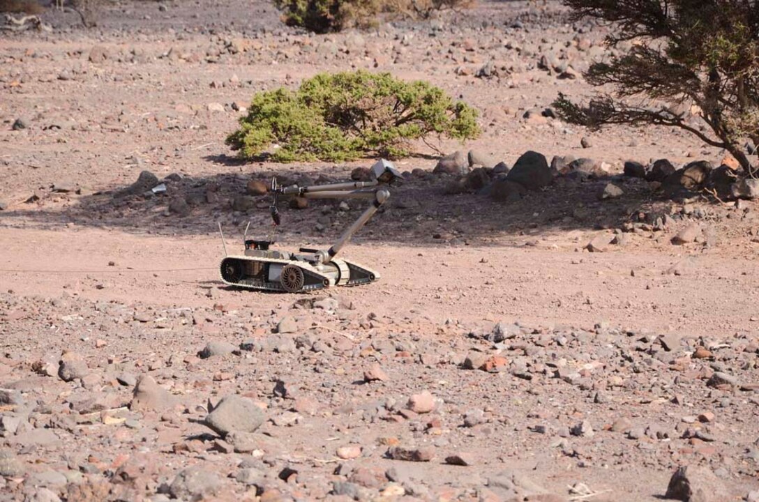 Marines assigned to Explosive Ordnance Detachment, 15th Marine Expeditionary Unit (MEU), employ a PAC Robot to detect improvised explosive devices during a practice sustainment training scenario at Port Arta, Djibouti, Dec. 12. 15th MEU is deployed as part of the Peleliu Amphibious Ready Group as a U.S. Central Command theater reserve force, providing support for maritime security operations and theater security cooperation efforts in the U.S. 5th Fleet area of responsibility. (U.S. Marine Corps photo by Cpl. Richard Sanglap-Heramis/Released)