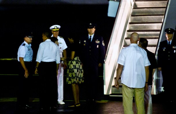 (From left) Col. Johnny Roscoe, 15th WIng commander, and Adm. Samuel J. Locklear, U.S Pacific Command commander, bid farewell to President Barack Obama and First Lady Michelle Obama as they depart Joint Base Pearl Harbor-Hickam, Hawaii, Jan. 5, 2013. The President and his family stayed on the island as part of their annual tradition of vacationing in Oahu during the holidays. (U.S. Air Force photo/Staff Sgt. Nathan Allen) 
