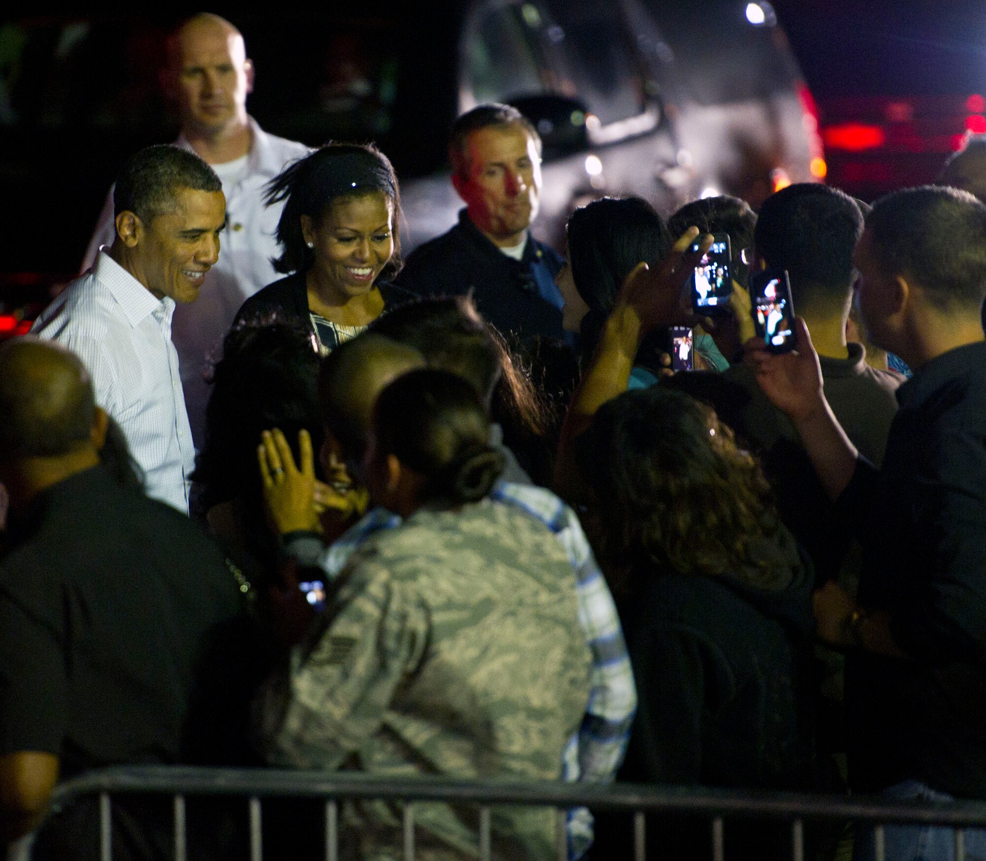 President Barack Obama and First Lady Michelle Obama are greeted by military servicemembers and their families before departing Joint Base Pearl Harbor-Hickam, Hawaii, Jan. 5. The President and his family stayed on the island as part of their annual tradition of vacationing in Oahu during the holidays. (U.S. Air Force photo by Staff Sgt. Nathan Allen)