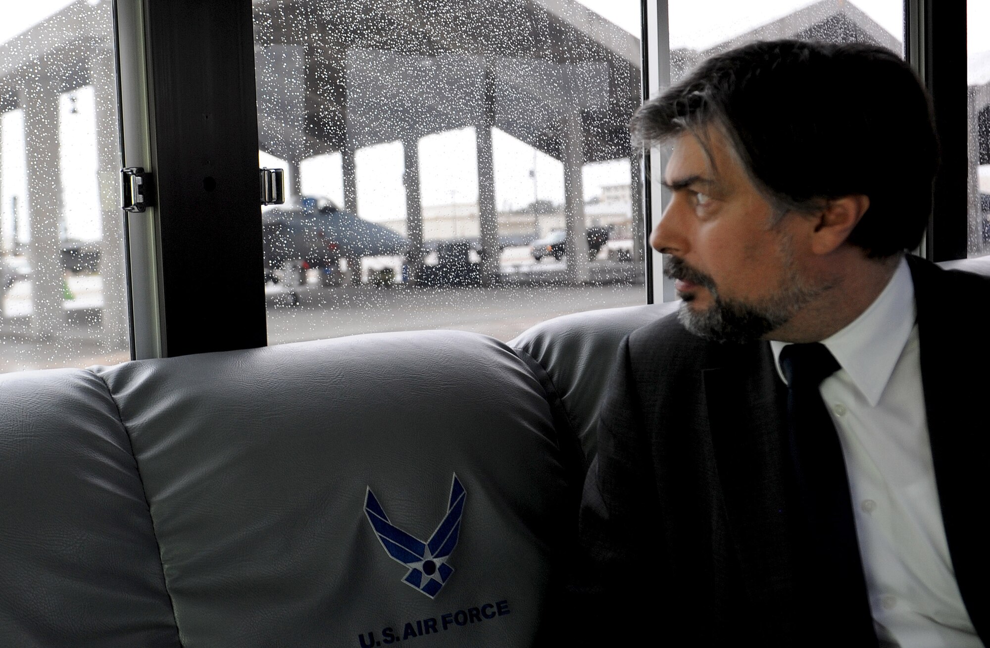 Cyryl Kozaczewski, Ambassador Extraordinary and Plenipotentiary of the Republic of Poland to Japan, looks at structures for aircraft on Kadena Air Base's flight line, Jan. 7, 2013. Molloy gave Kozaczewski a tour of the base which strengthens ties between U.S. and allied nations. Kozaczewski has spent time as the Polish Civilian Representative to North Atlantic Treaty Organization and from that experience he has some understanding of military issues. The Polish Embassy is also the current representative for NATO in the Asia-Pacific Region. (U.S. Air Force photo/Airman 1st Class Malia Jenkins)