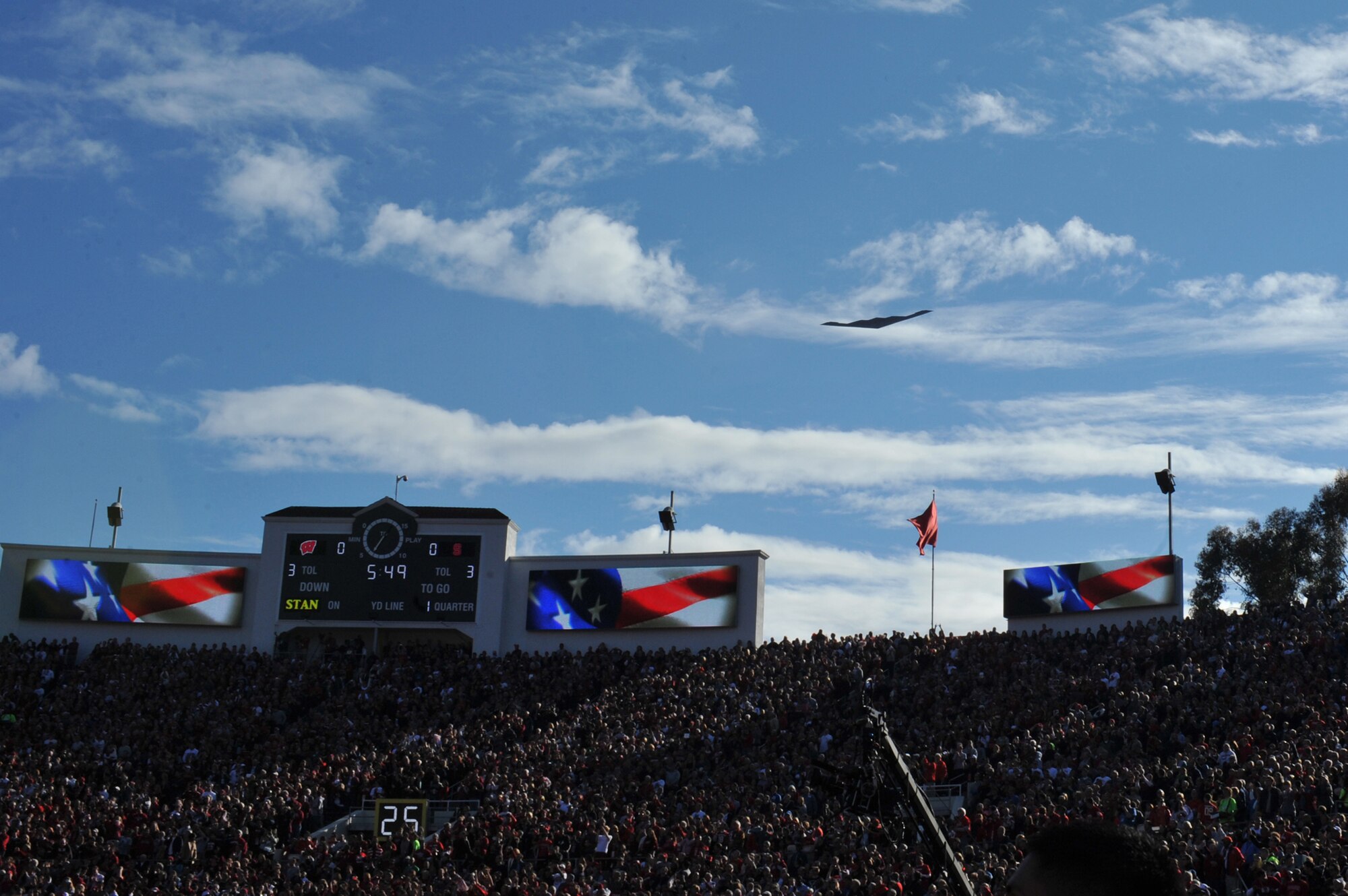 A B-2 Bomber flies over the Rose Bowl prior to the start of the football game, Jan. 1. The bomber is from the 50th Bomb Wing based at Whiteman AFB, Mo. (Photo by Sarah Corrice)