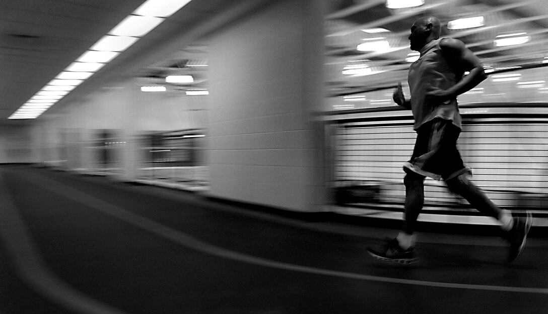 Darryl Brickhouse,1st Logistics Readiness Squadron fuel specialist, runs on the track at Shellbank Fitness Center, Jan. 7, 2012 at Langley Air Force Base, Va. Brickhouse said he comes to the fitness center every day as part of his exercise routine.  (U.S. Air Force photo by Staff Sgt. Katie Gar Ward/Released)   