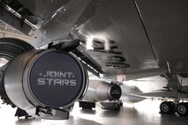 An E-8C test aircraft is displayed during a Joint Surveillance Target Attack Radar System exhibition in a hangar at Joint Base Langley-Eustis, Va., Dec. 18, 2012. Joint STARS provides wide area situational awareness and early warning for U.S. and multinational maritime task forces. (U.S. Air Force photo by Staff Sgt. Krystie Martinez/Released)