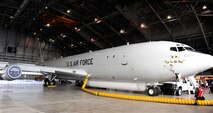 An E-8C test aircraft is displayed during a Joint Surveillance Target Attack Radar System exhibition in a hangar at Joint Base Langley-Eustis, Va., Dec. 18, 2012. Joint STARS provides wide area situational awareness and early warning for U.S. and multinational maritime task forces. (U.S. Air Force photo by Staff Sgt. Krystie Martinez/Released)
