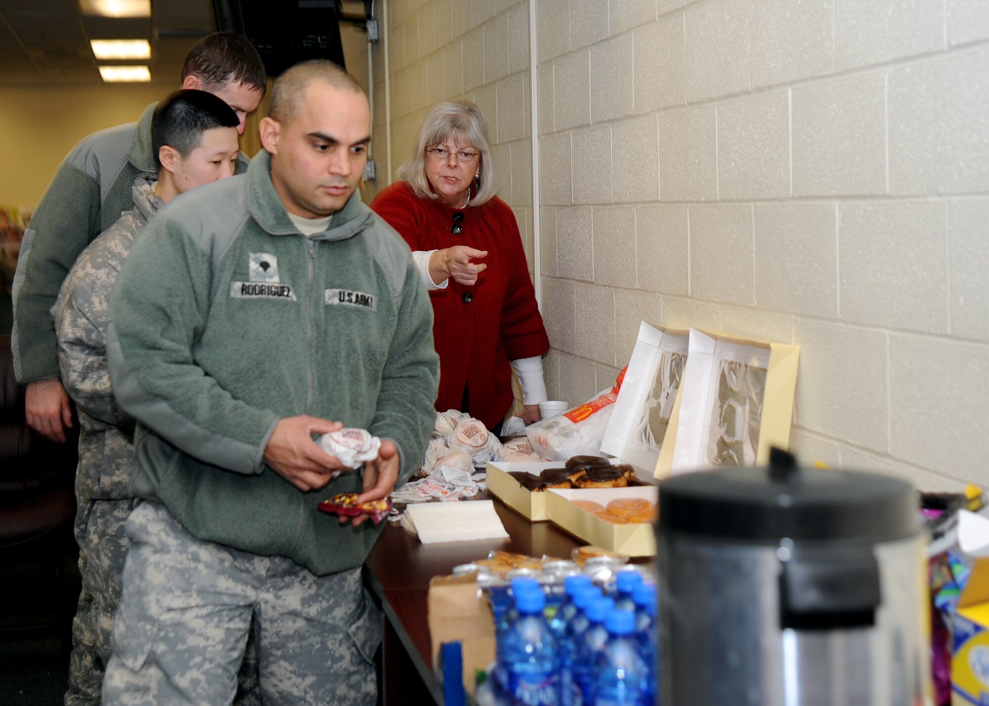 ALTUS AIR FORCE BASE, Okla. – Soldiers with the 3-2 Air Defense Artillery Battalion, Fort Sill, Okla., line up for breakfast at the deployment center, Jan. 5, 2012. The Altus Military Affairs Committee and community members donated food and drinks for deploying soldiers as a way to show their appreciation. (U.S. Air Force photo by Airman 1st Class Klynne Pearl Serrano / Released)