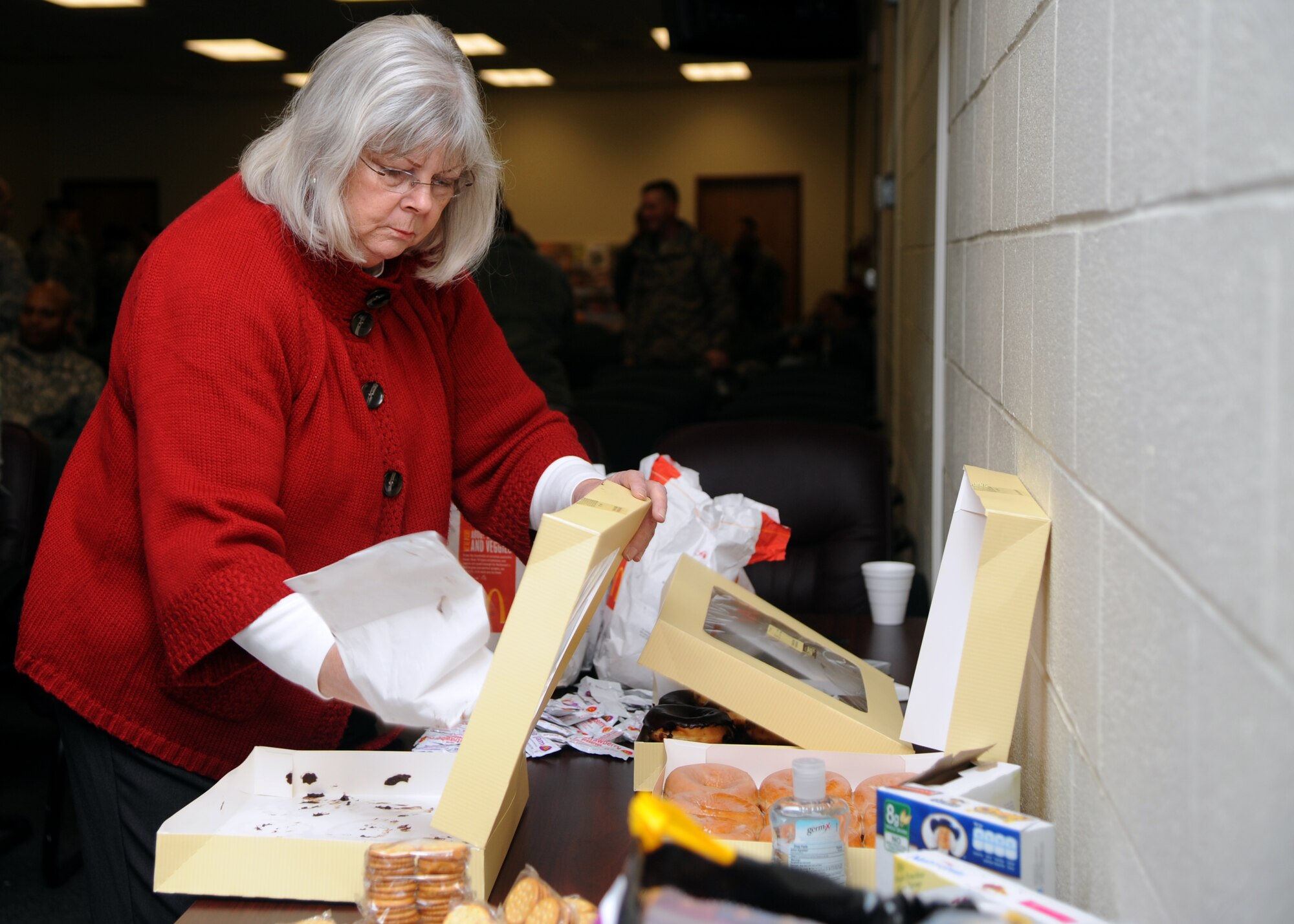 ALTUS AIR FORCE BASE, Okla. – Barbara Burleson, Altus Military Affairs Committee member, prepares food and drinks for Soldiers from the 3-2 Air Defense Artillery Battalion, Fort Sill, Okla. at the deployment center, Jan. 5, 2012. The Altus MAC and community members donated food and drinks for deploying soldiers as a way to show their appreciation. (U.S. Air Force photo by Airman 1st Class Klynne Pearl Serrano / Released)