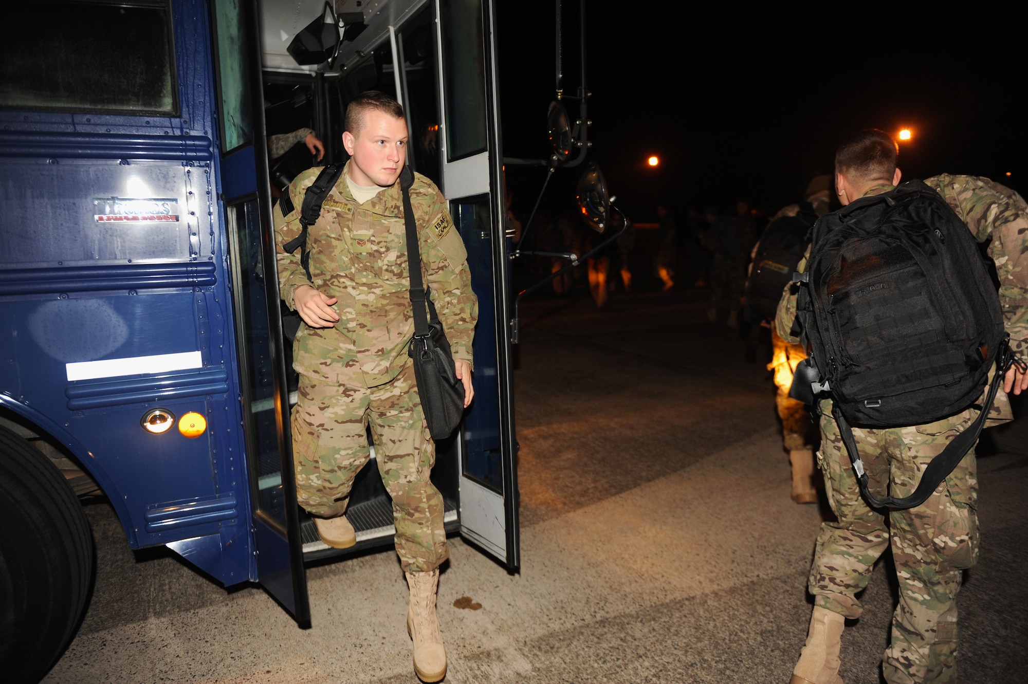 Team Little Rock members depart busses on the flight line Jan 6, 2013, at Little Rock Air Force Base, Ark. More than 170 military members deployed to Southwest Asia to support Air Force operations. (U.S. Air Force photo by Airman 1st Class Ethan Dunagan)