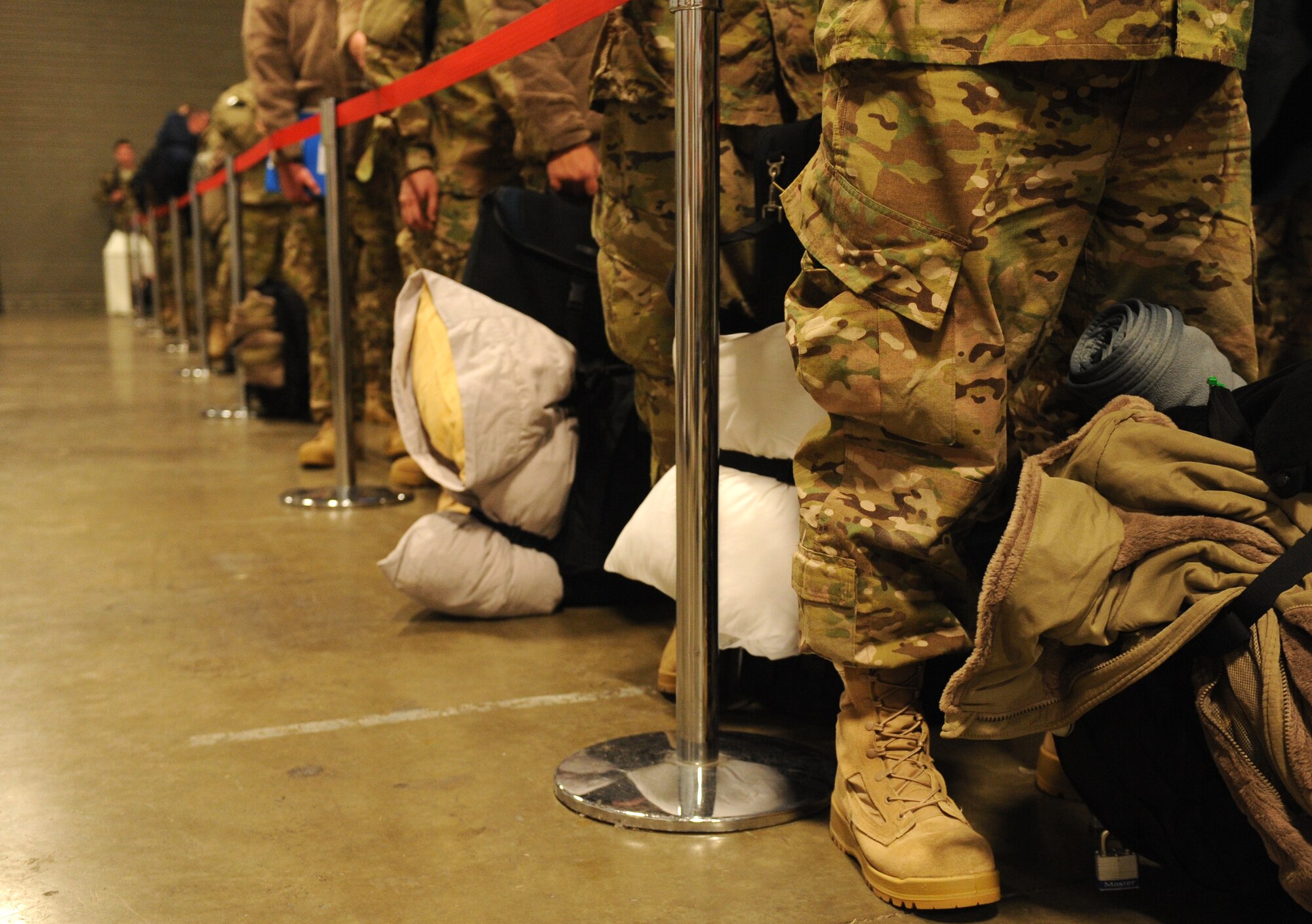Team Little Rock members wait in line to get their weight recorded Jan. 6, 2013, at Little Rock Air Force Base, Ark. More than one hundred seventy military members had to be weighed before deploying to Southwest Asia. (U.S. Air Force photo by Airman 1st Class Ethan Dunagan)