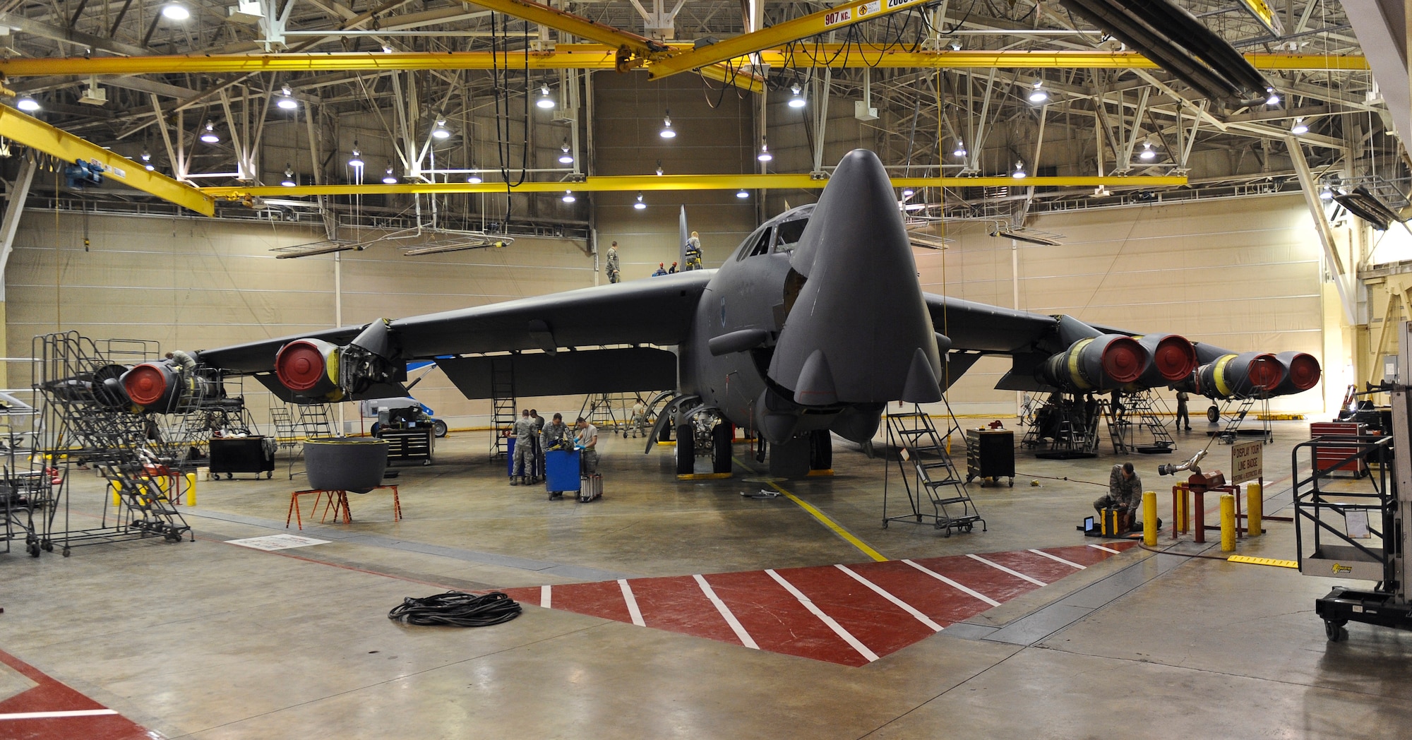Maintenance Airmen work on a B-52H Stratofortress inside the Phase Hangar on Barksdale Air Force Base, La., Jan. 7. Once a B-52 has accumulated 450 flying hours, it is sent to the Phase Hangar for a 14-day inspection where the aircraft is taken apart and examined for discrepancies. Once all the discrepancies are logged and repaired, the aircraft is returned to the flightline to carry out the mission. (U.S. Air Force photo/Senior Airman Micaiah Anthony)