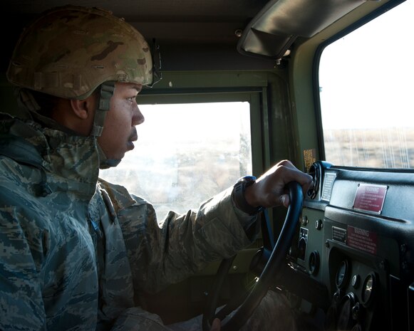 Lawton, Okla. – Staff Sgt. Xavier Drake, 97th Security Forces Squadron base defense operations controller, drives an Air Force Humvee as part of a convoy from Fort Sill, Okla. to Altus Air Force Base, Okla., Jan. 3, 2013. Through multiple convoys, Soldiers from the 31st Air Defense Artillery Brigade, Fort Sill, drove more than two million pounds of equipment to Altus AFB to prepare for a deployment to Turkey. The deployment followed U.S. Defense Secretary Leon Panetta’s orders Dec. 14, 2012 to deploy batteries of Patriot-air-defense systems. (U.S. Air Force photo by Senior Airman Kenneth W. Norman / Released)