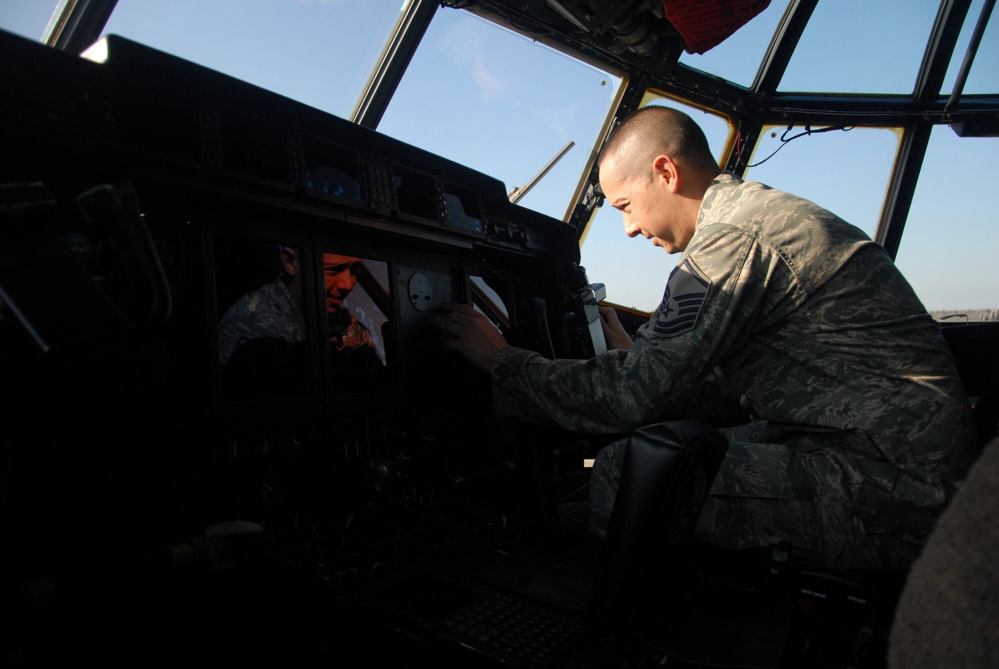 Master Sgt. George Terrell, 314th MXG quality assurance avionics inspector, evaluates avionic systems Dec. 17, at Little Rock Air Force Base.  Terrell, a Colorado Springs, Colo. native, led the inspection team for the Royal Thai Air Force site survey. During this survey, he evaluated the maintenance discipline and procedures of 34 RTAF technicians performing repairs on 12 host nation C-130H aircraft. (U.S. Air Force photo by Airman 1st Class Regina Agoha) 