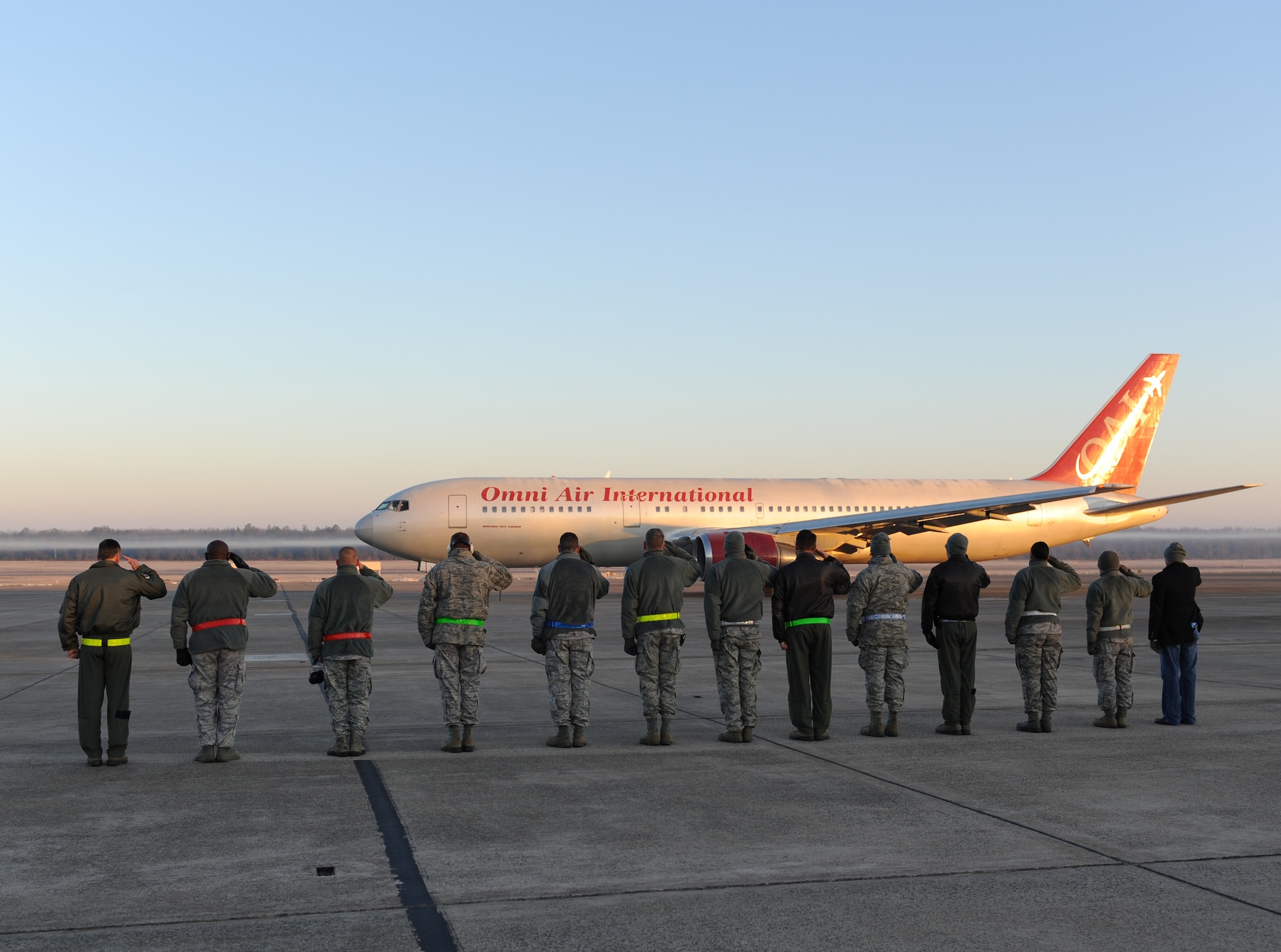 Leaders from the Little Rock Air Force Base render a salute to departing Airmen Jan. 7, 2013, at Little Rock Air Force Base, Ark.  More than one hundred and seventy base personnel boarded a chartered airliner to deploy to Southwest Asia. (U.S. Air Force photo by Tech. Sgt. Chad Chisholm)