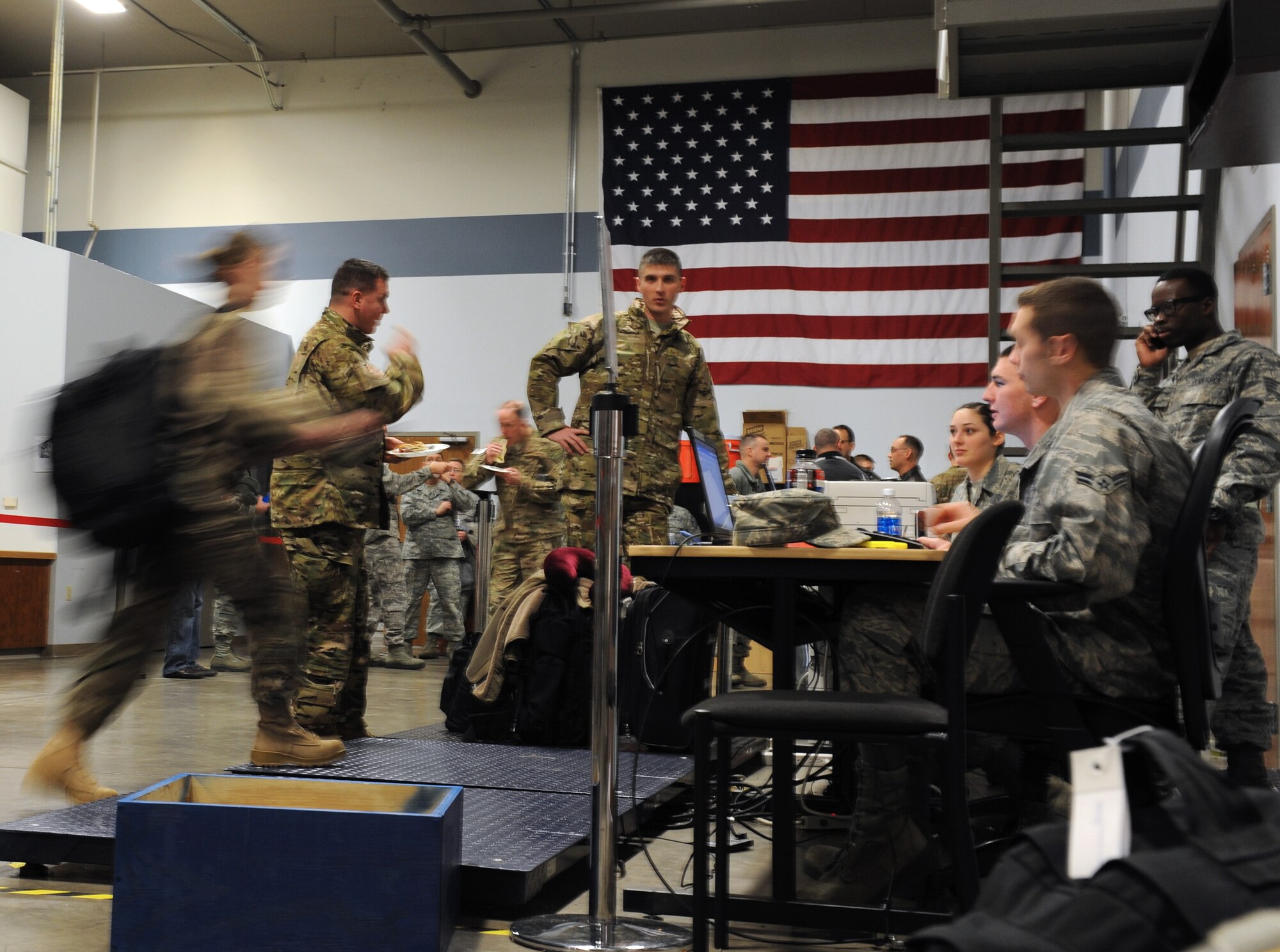 Team Little Rock members prepare to be weighed during their check in for a deployment Jan. 7, 2013, at Little Rock Air Force Base, Ark.  The Airmen are deploying from LRAFB to Southwest Asia in support of Air Force Operations. (U.S. Air Force photo by Tech. Sgt. Chad Chisholm)