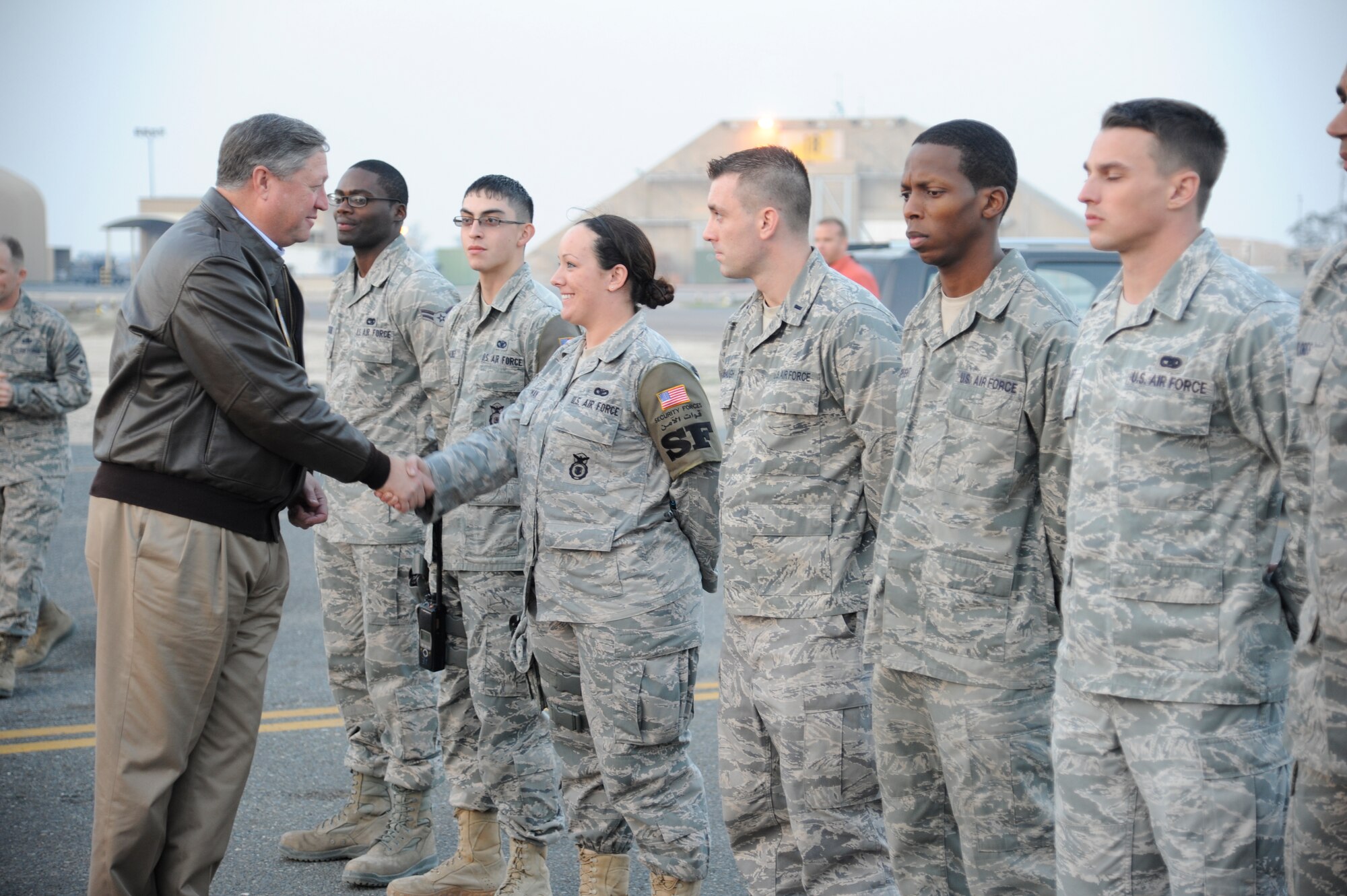 Secretary of the Air Force Michael Donley greets Airmen at the 386th Air Expeditionary Wing during a visit to a base in Southwest Asia on Dec. 30, 2012. Donley and Chief Master Sgt. of the Air Force James Roy visited the wing as part of a multi-base tour of the region to thank Airmen for their service and to discuss Air Force issues. (U.S. Air Force photo by Staff Sgt. Austin Knox)