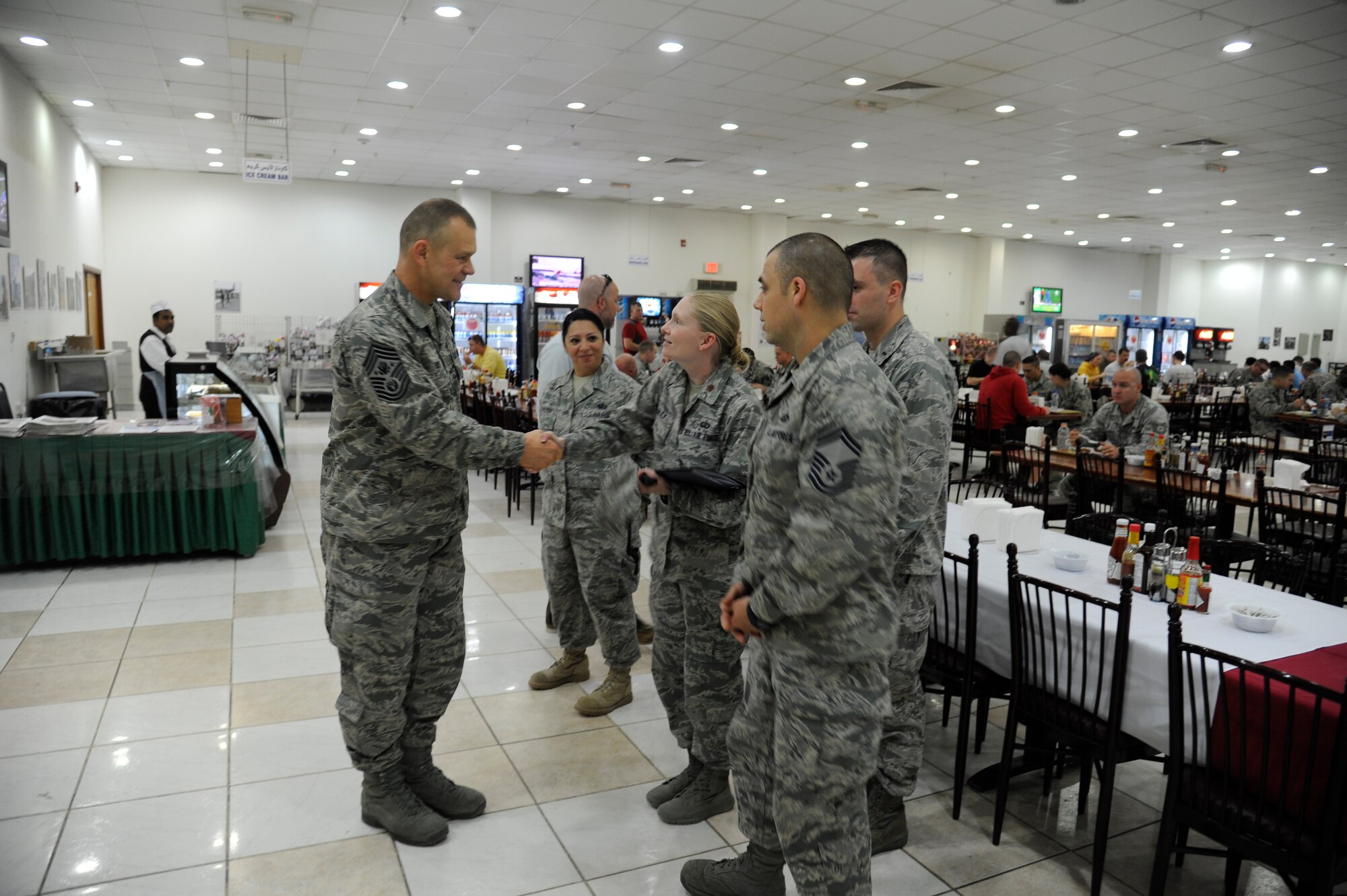 Chief Master Sgt. of the Air Force James Roy greets Airmen at the 386th Air Expeditionary Wing during a visit to a base in Southwest Asia on Dec. 30, 2012.  CMSAF Roy accompanied Secretary of the Air Force Michael Donley as they toured bases in the U.S. Air Forces Central Command area of responsibility. (U.S. Air Force photo by Staff Sgt. Austin Knox)