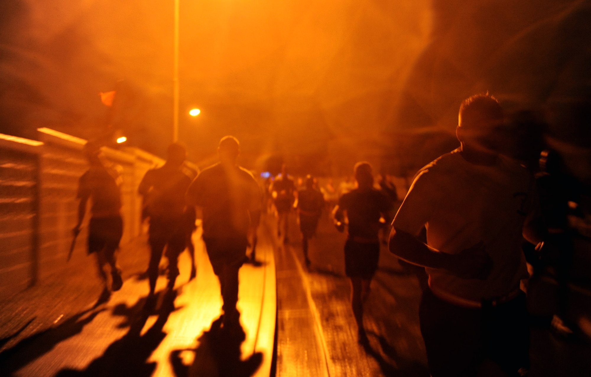 Runners endure the rain and cold during a 5K on Kadena Air Base, Japan, Jan. 4, 2013. At registration the runners made donations that will be given to Sandy Hook Elementary School after the horrific shooting that took place in December. (U.S. Air Force photo/Airman 1st Class Brooke P. Doyle)