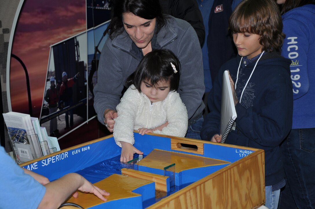 Kids and adults alike take a look at a Soo Locks replica that explains the drop in water levels and how ships pass from one lake to another while at the 2012 Detroit Boat Show. Be sure to check it out at this year's show Feb. 16-24 at Cobo Center.
