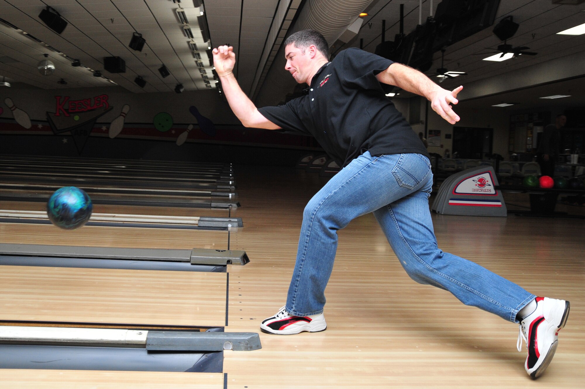 Tech. Sgt. Robert Register, 403rd Aircraft Maintenance Squadron, slings a ball down the lane during Bowl-a-palooza at Keesler Air Force Base, Miss., Jan. 5, 2013. The event was organized by members of the 403rd Wing Human Resource Development Council and Wingman’s Council to help promote teamwork and camaraderie within the wing. The 403rd AMXS team “We Win” took first place for the three games bowled, with a combined average score of 678; second place went to 403rd Maintenance Group team “Hawaii 5-0” with 676 points; and third place was taken by 403rd Logistics Readiness Squadron Team One with a score of 646. (U.S. Air Force photo/Tech. Sgt. Ryan Labadens)