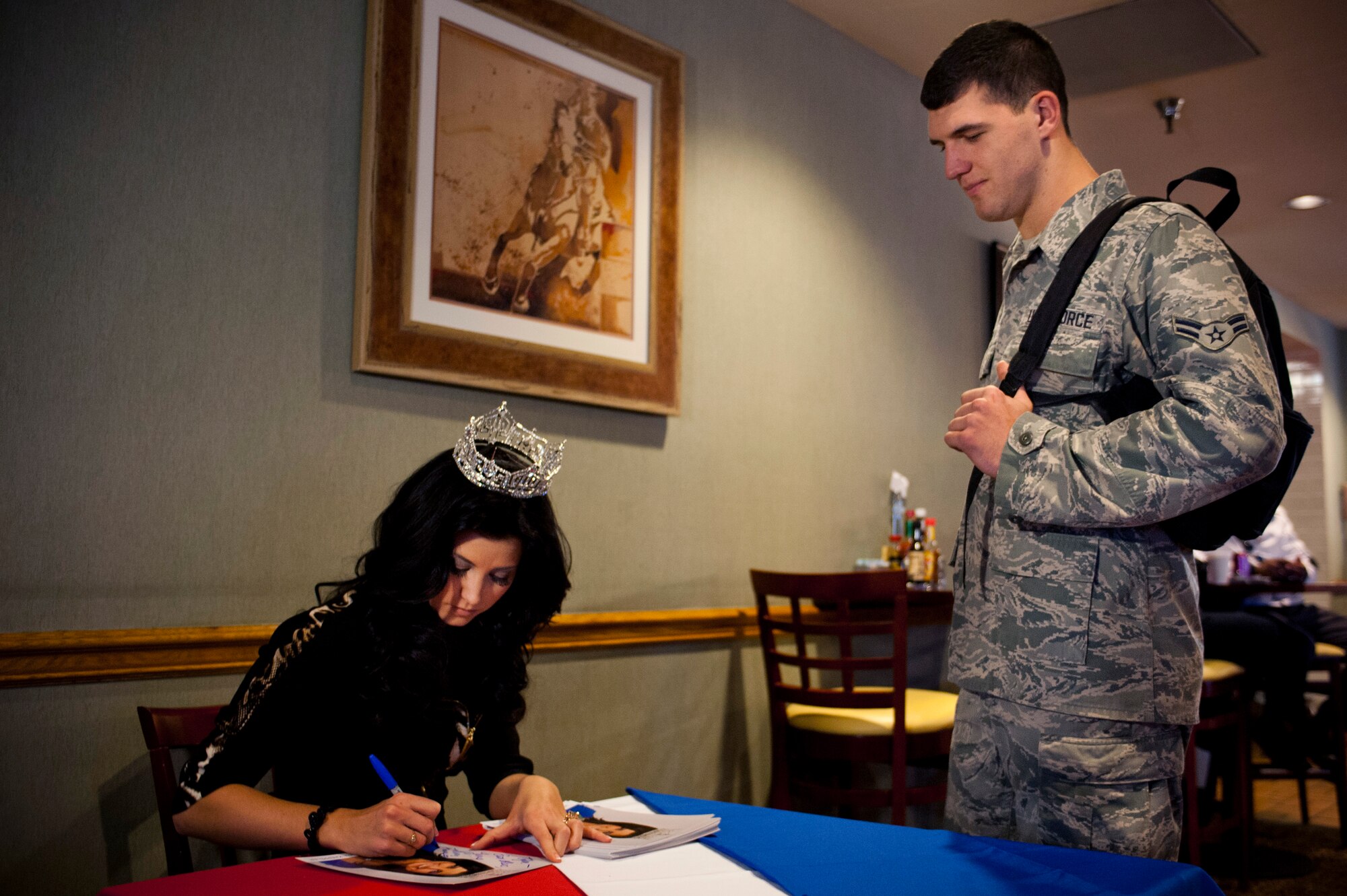 Lauren Kaeppeler, Miss America 2012, signs autographs for Nellis Airmen, Jan. 8, 2013, at Nellis Air Force Base, Nev. Kaeppeler is set to crown the next Miss America on Jan. 12 at Planet Hollywood Hotel and Casino, in Las Vegas. (U.S. Air Force Photo by Airman 1st Class Jason Couillard) 