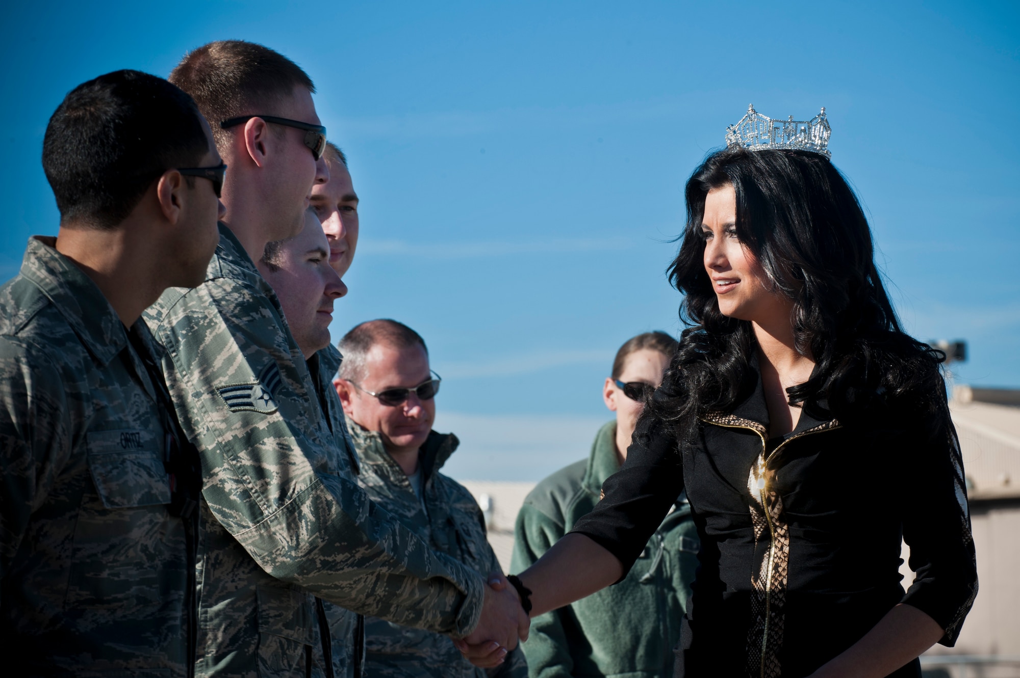 Laura Kaeppeler, Miss America 2012, thanks Airmen for their service during a tour, Jan. 8, 2013, at Nellis Air Force Base, Nev. During the visit, Kaeppeler visited the Child Development Center, Thunderbirds Hangar, a static F-22 Raptor display, and the Dining Facility where she signed autographs and took photos with Airmen. (U.S. Air Force Photo by Airman 1st Class Jason Couillard)