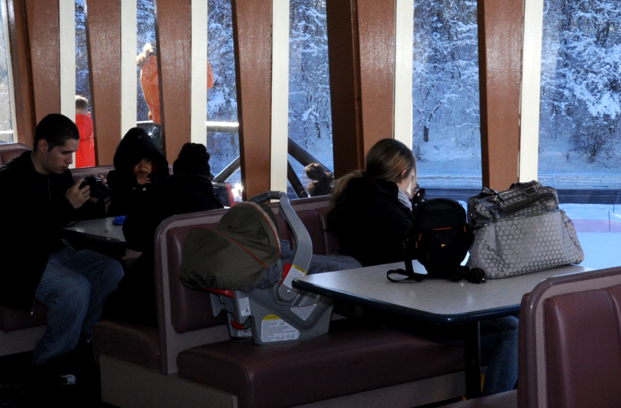 While watching their children have fun in the snow, parents enjoy free hot cocoa and coffee offered by the Land Memorial Ski Lodge at Misawa Air Base, Japan, Jan. 5, 2013. For more information on the ski lodge’s treats and private reservations availability, contact the Outdoor Recreation Center at 226-9378. (U.S. Air Force photo by Airman 1st Class Kenna Jackson)