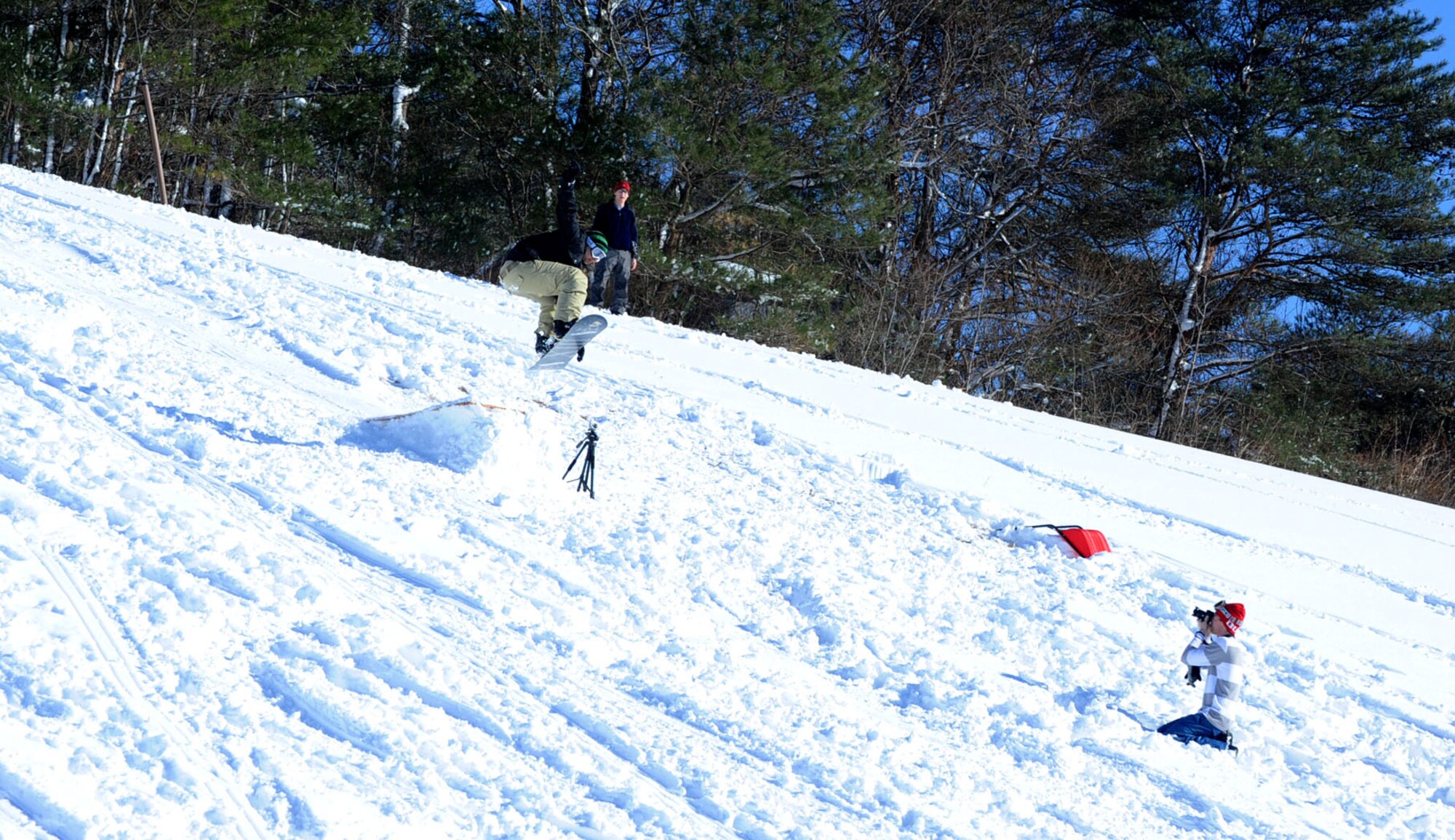 Avid snowboarders and skiers photograph each other’s stunts outside the Land Memorial Ski Lodge at Misawa Air Base, Japan, Jan. 5, 2013. The ski lodge operation hours are Fridays from 4 p.m. to 9 p.m. and Saturdays and Sundays from 10 a.m. to 5 p.m. In between family fun activities, snow-lovers are given free hot cocoa and coffee, as well as a chance to lounge on the couches while gazing at the snowy view. (U.S. Air Force photo by Airman 1st Class Kenna Jackson)