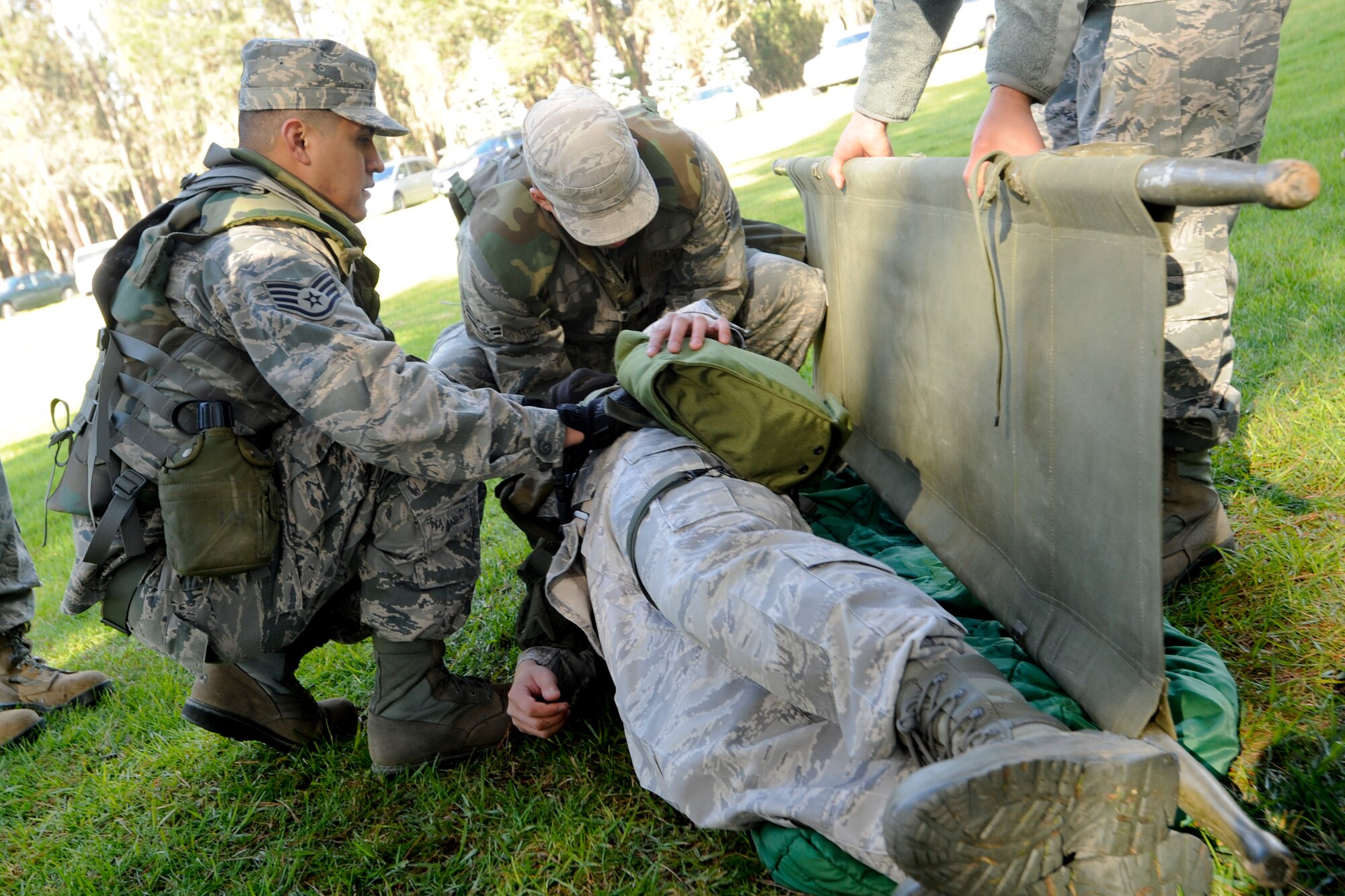 VANDENBERG AIR FORCE BASE, Calif. -- Airmen practice Self-Aid and Buddy Care using a stretcher during a scenario here Monday, Jan. 7, 2013. The Northstar exercise is designed to test the deployment capabilities and combat survival skills of Vandenberg Airmen. (U.S. Air Force photo/Airman Yvonne Morales)