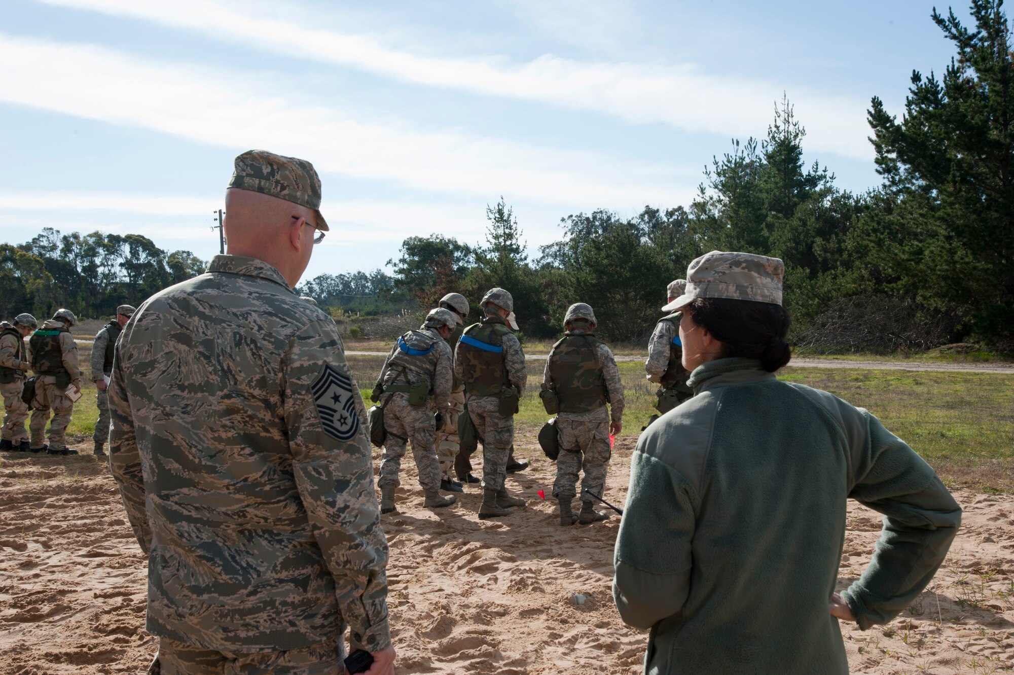 VANDENBERG AIR FORCE BASE, Calif. --  Col. Nina Armagno, 30th Space Wing commander, and Chief Master Sgt. Ryan Peterson, 30th SW command chief, observe a post-attack reconnaissance line searching for Unexploded Ordnance to practice for a Northstar exercise at Cocheo Park here Monday, Jan. 7, 2013. Team V members practiced skills that they will use in a deployed environment. (U.S. Air Force photo/Senior Airman Lael Huss)
