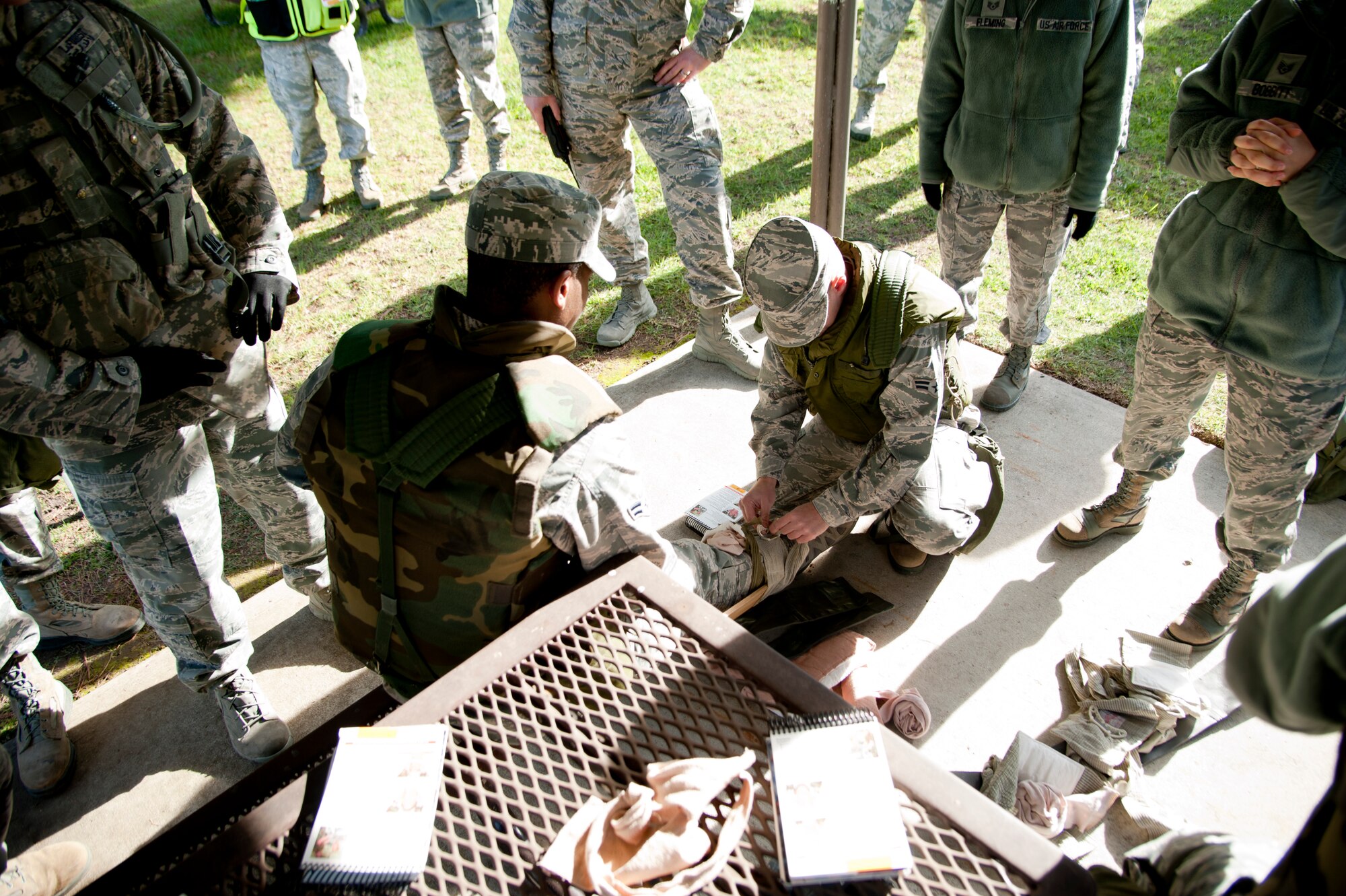 VANDENBERG AIR FORCE BASE, Calif. -- Vandenberg Airmen practice splinting at a Self-Aid and Buddy Care station during training for Northstar exercise here at Cochoe Park, Monday, Jan. 7, 2013. The Northstar exercise is designed to test the deployment capabilities and combat survival skills of Vandenberg Airmen. (U.S. Air Force photo/Senior Airman Lael Huss)
