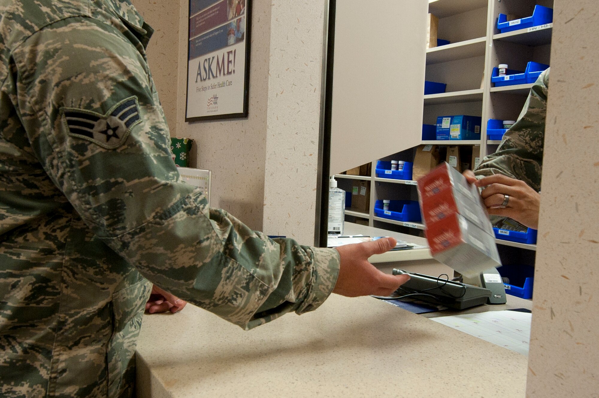 A customer recieves tobacco cessation medication at the base pharmacy on Hurlburt Field, Fla., Dec. 20, 2012. The 1st Special Operations Medical Group pharmacy is offering medications to help Hurlburt personnel who wish to quit tobacco use. (U.S. photo by Staff Sgt. Sarah Martinez)