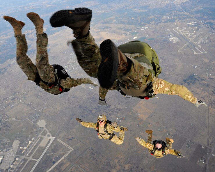 Survival, evasion, resistance and escape specialists perform a free-fall jump over Fairchild Air Force Base, Wash., Nov. 6, 2012. Static line and free-fall jumps are mandatory training courses to become a SERE specialist. (U.S. Air Force photo/Airman 1st Class Ryan Zeski)