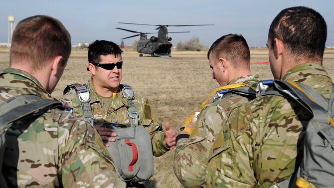 Before executing static-line jumps, Tech. Sgt. Jason Martinez gives instructions regarding the static-line jumps at Fairchild Air Force Base, Wash., Nov. 6, 2012. Static line and free-fall jumps are mandatory training courses to become a SERE specialist. Martinez is a survival, evasion, resistance and escape specialist with the 336th Training Group. (U.S. Air Force photo/Airman 1st Class Ryan Zeski)
