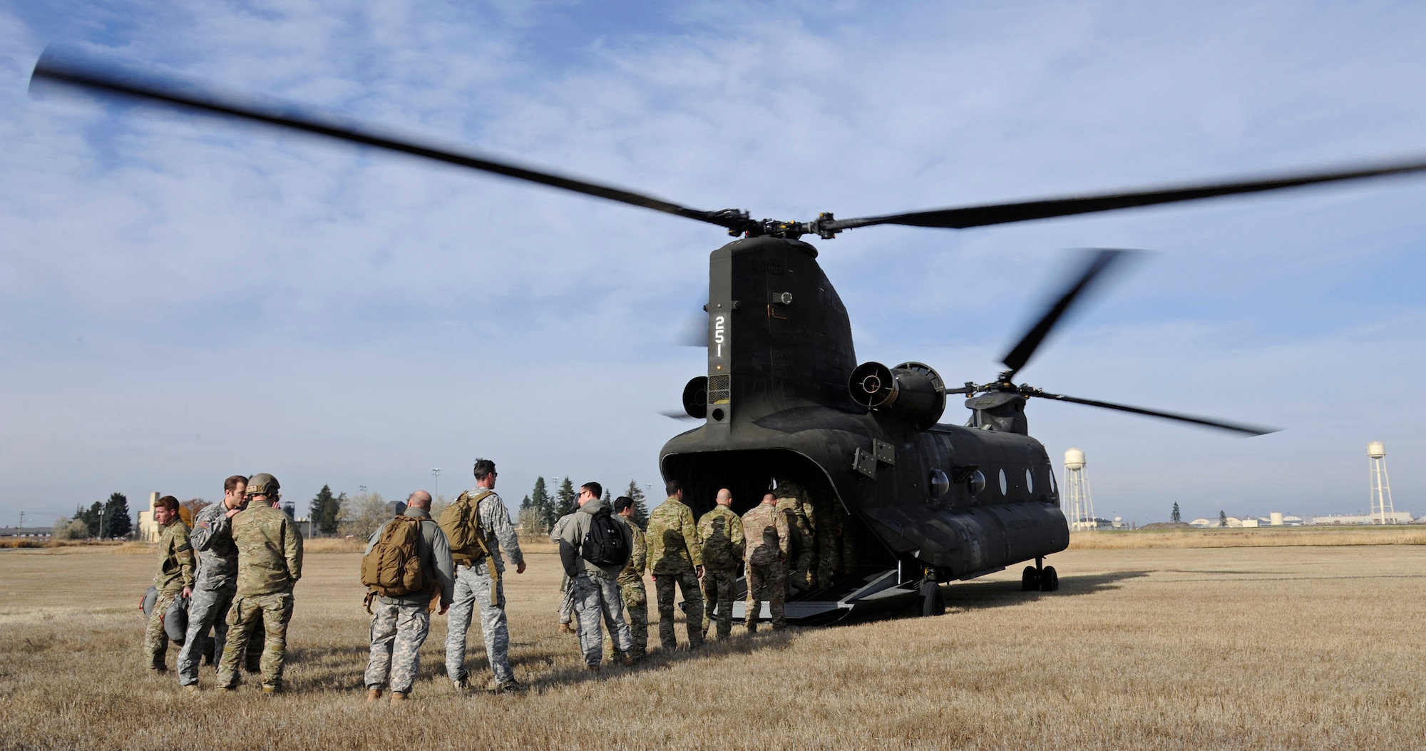 Survival, evasion, resistance and escape specialists load into a CH-47 Chinook helicopter to practice static-line jumps at Fairchild Air Force Base, Wash., Nov. 6, 2012. These jumps are performed by instructors and students to ensure students are receiving the proper training. (U.S. Air Force photo by Airman 1st Class Ryan Zeski)